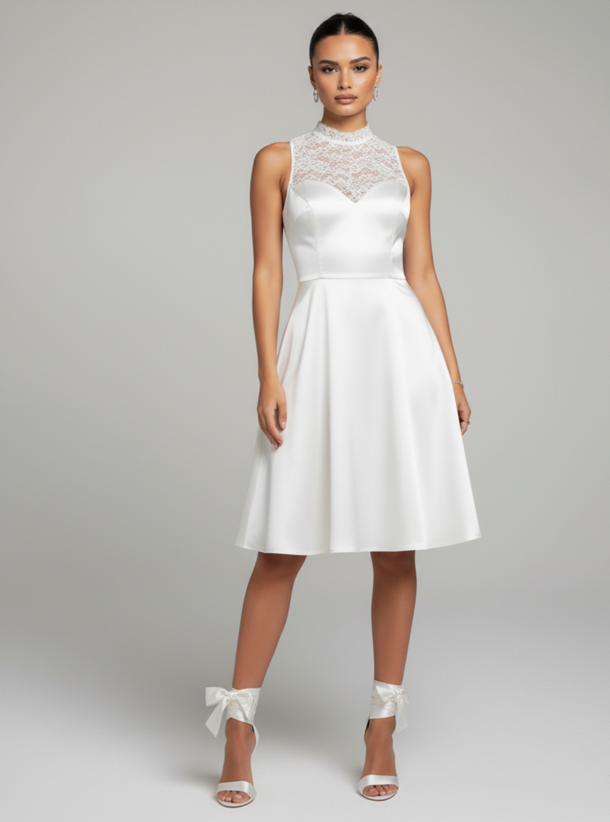 White dress worn by a model on a gray background
