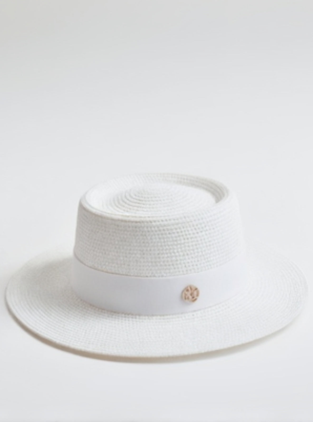 White straw hat with a band featuring a logo on a white background