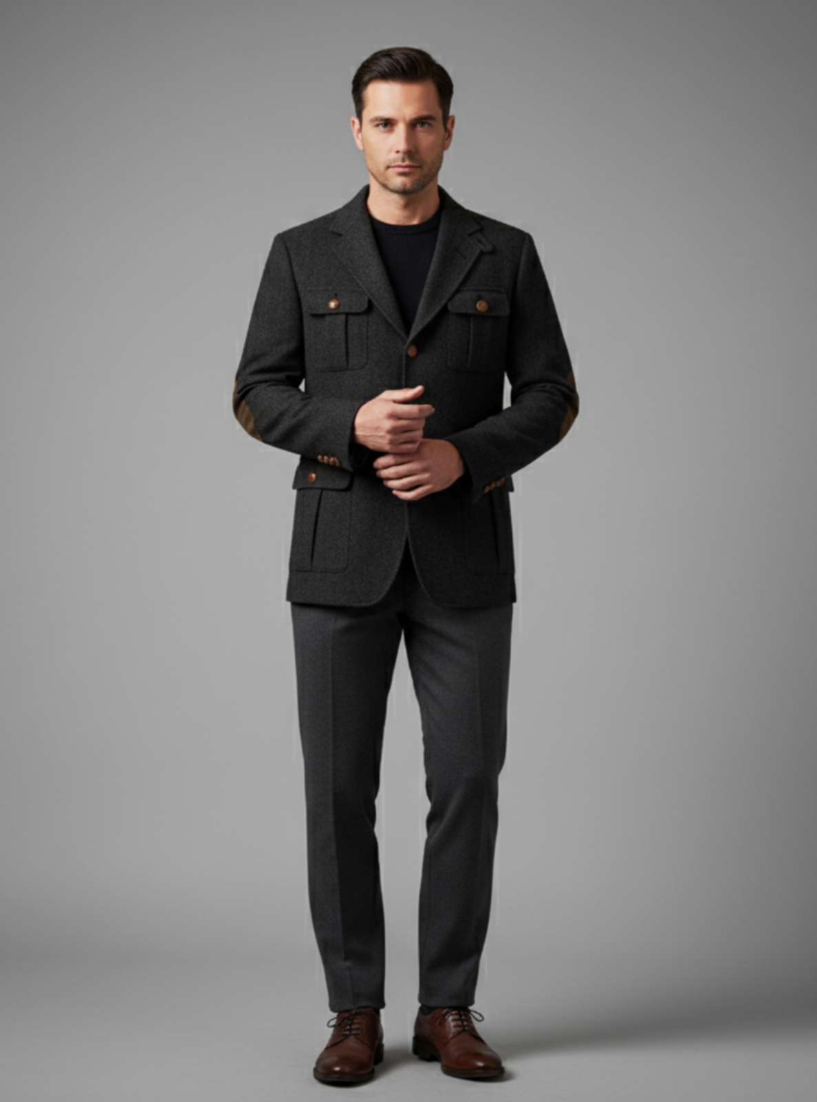Man wearing a dark suit with a gray background