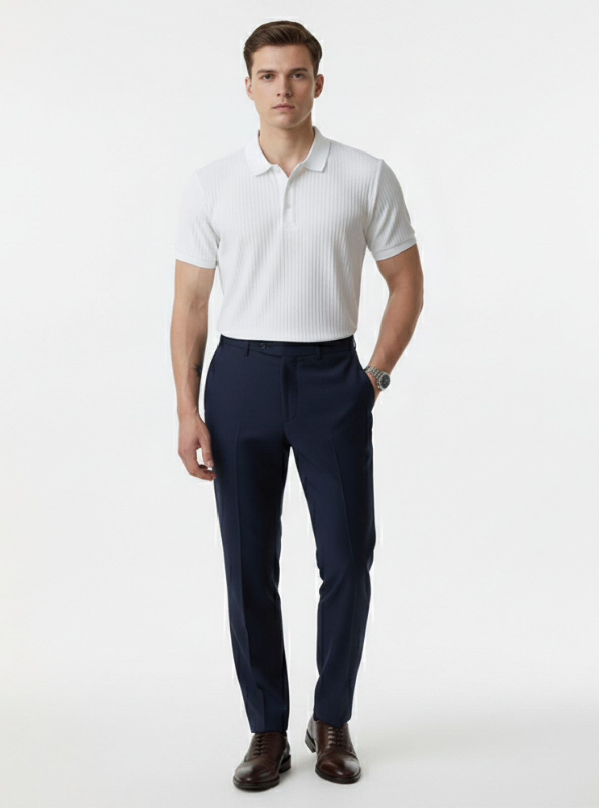 Man wearing a white polo shirt and navy pants on a white background