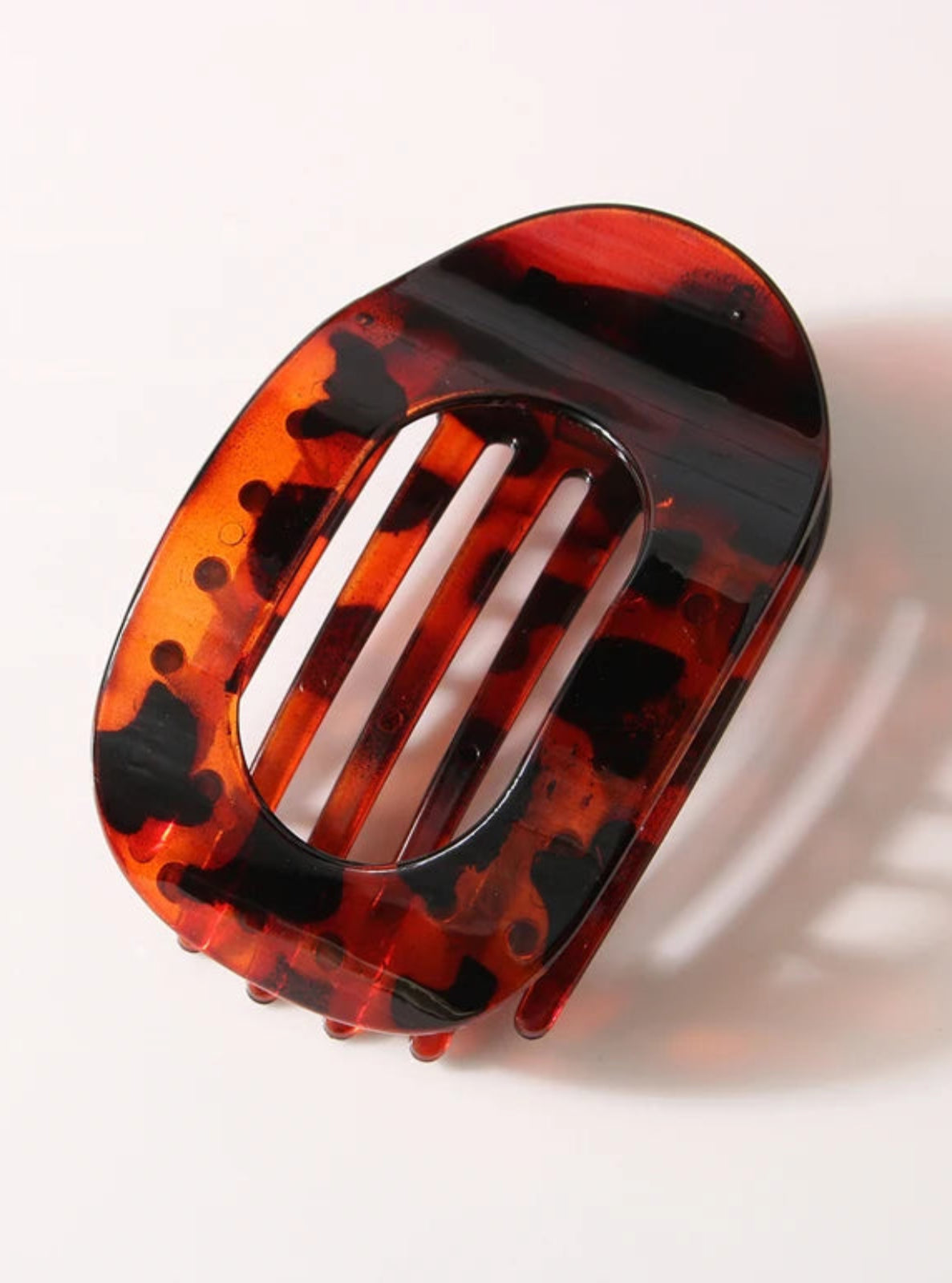 Havana tortoiseshell hair clip on a white background