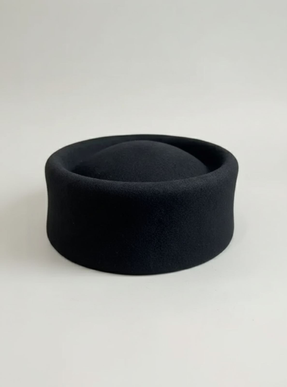 Black felt hat on a white background