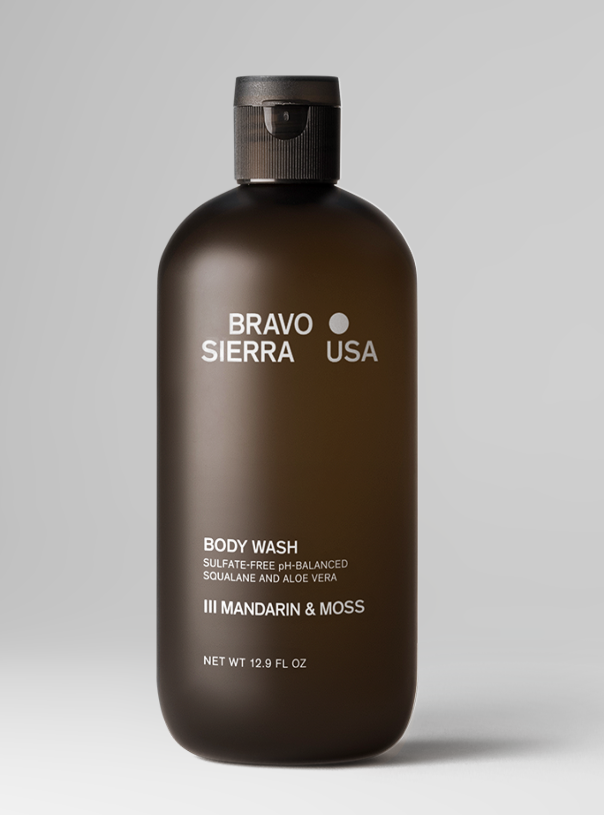 Brown body wash bottle with 'Bravo Sierra USA' branding on a gray background