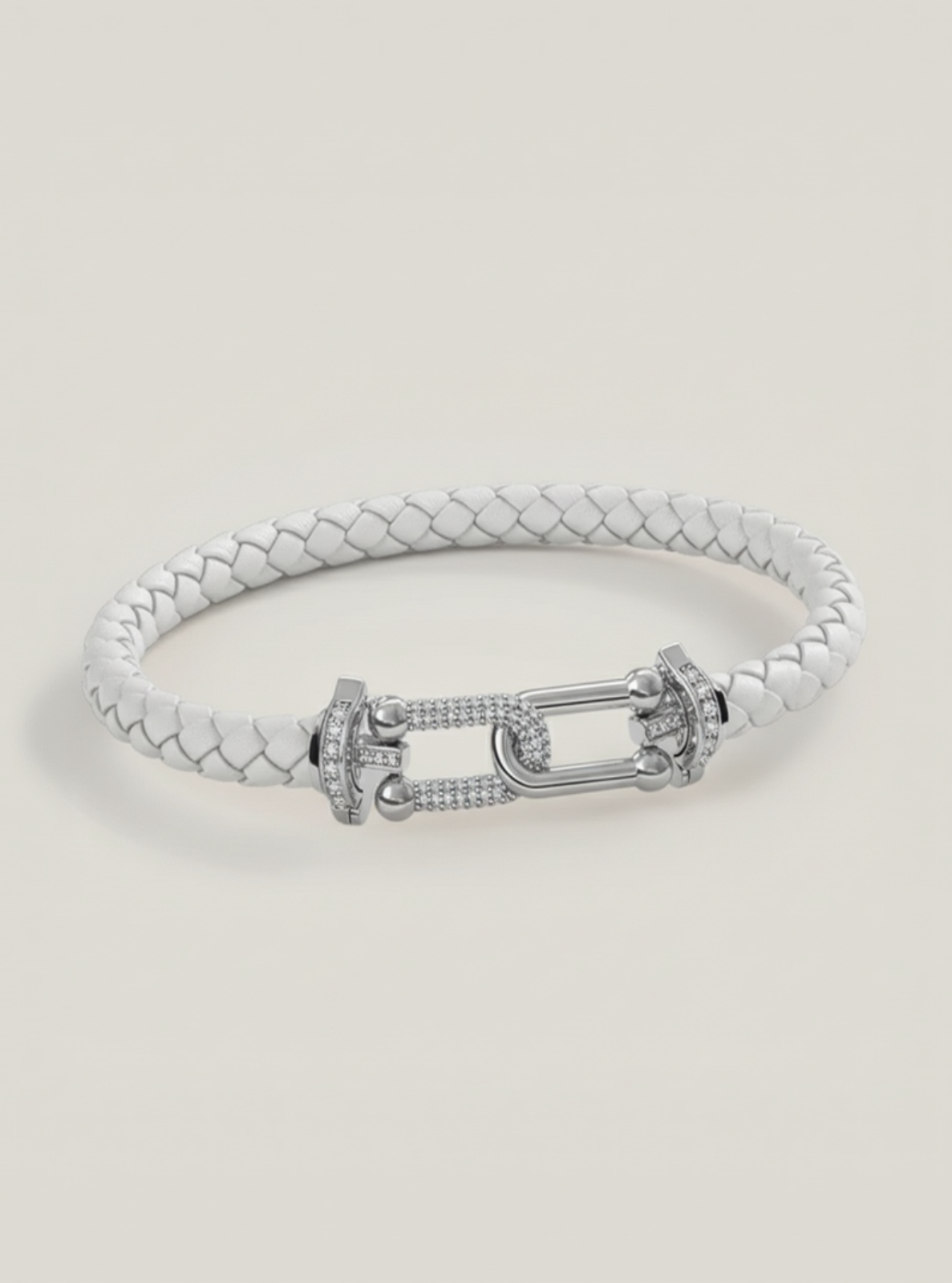 Silver bracelet with a lock clasp on a light gray background