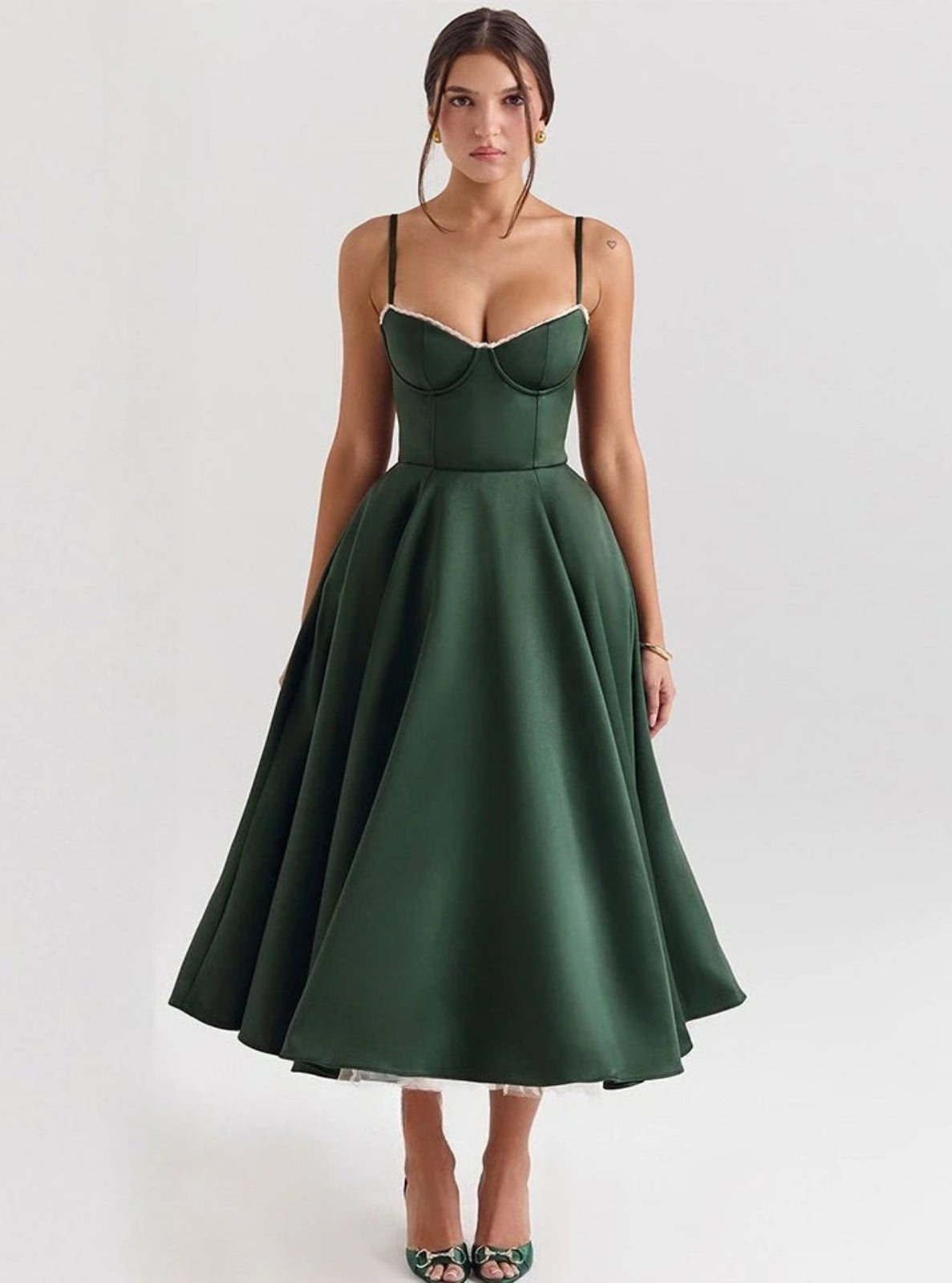 Woman wearing a green dress on a white background