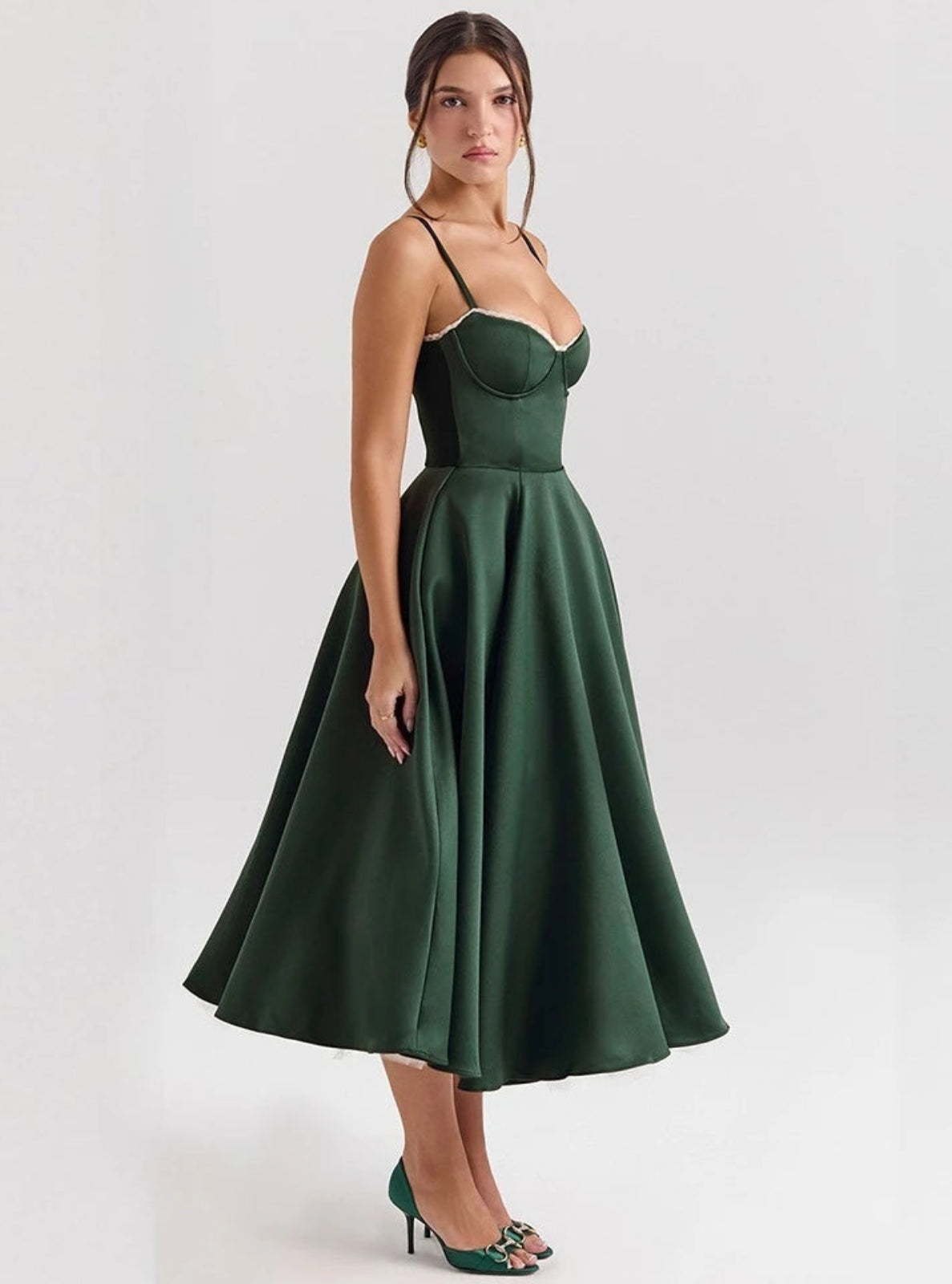 Woman wearing a green dress on a white background