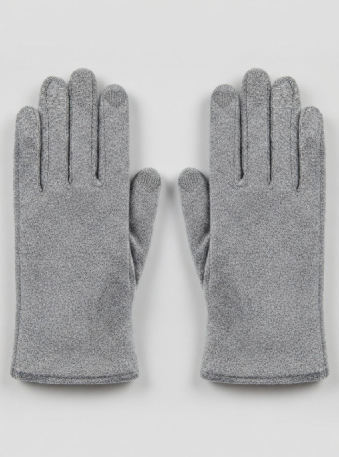 Pair of gray gloves on a light gray background