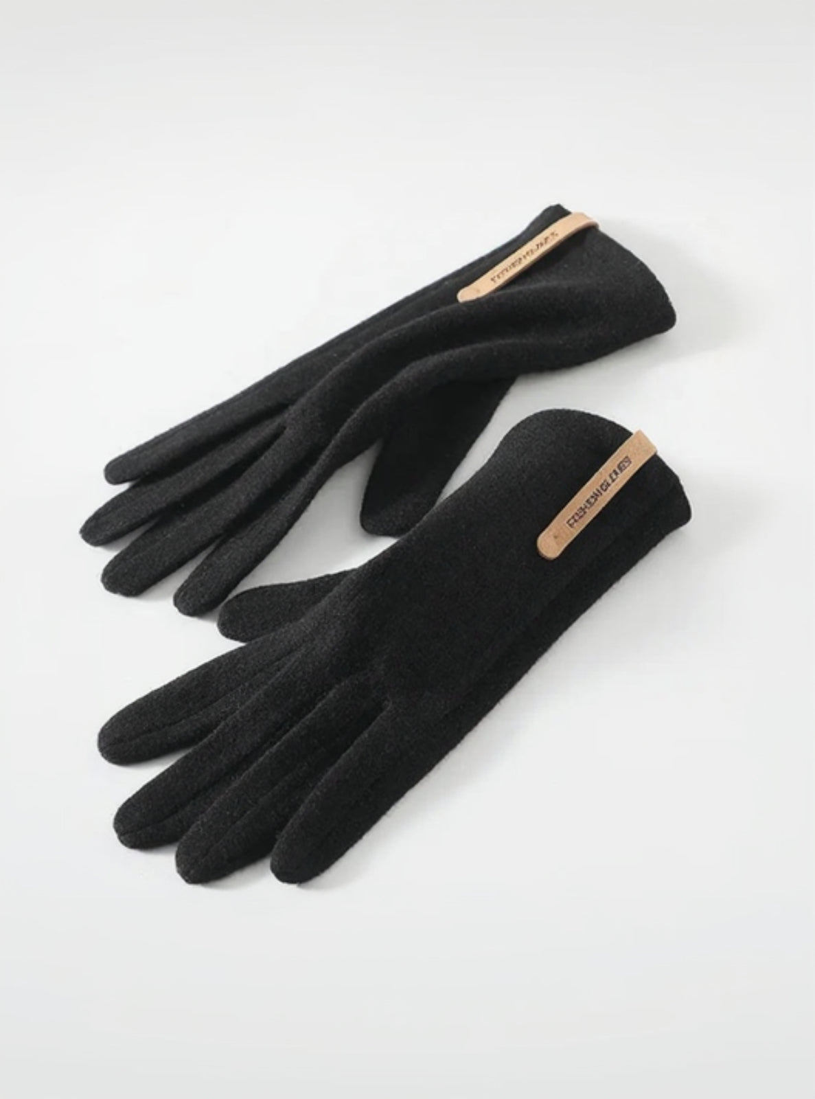 Pair of black gloves with a brand logo on a white background