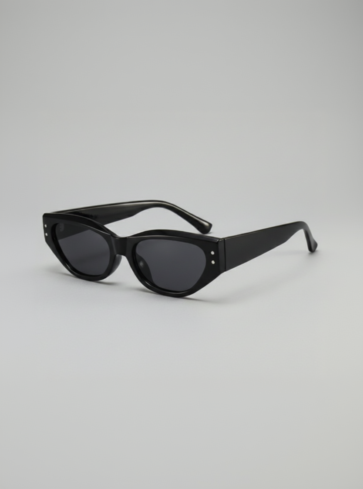 Black sunglasses on a light gray background