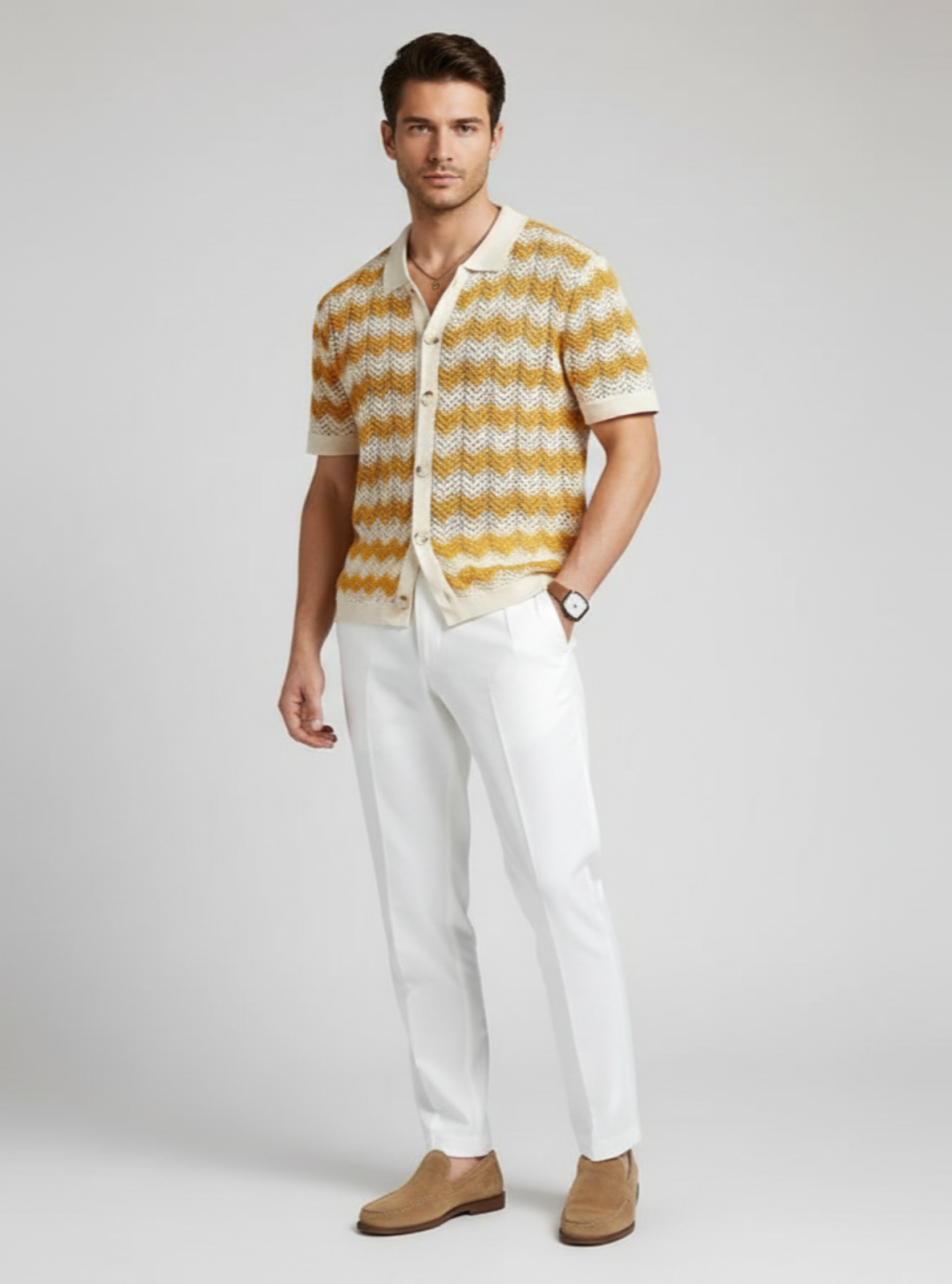 Man wearing a yellow and white striped shirt with white pants on a gray background