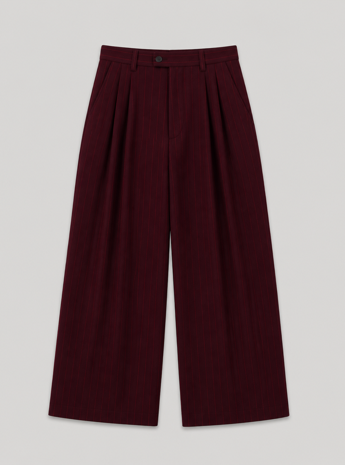 Maroon pleated pants on a light gray background