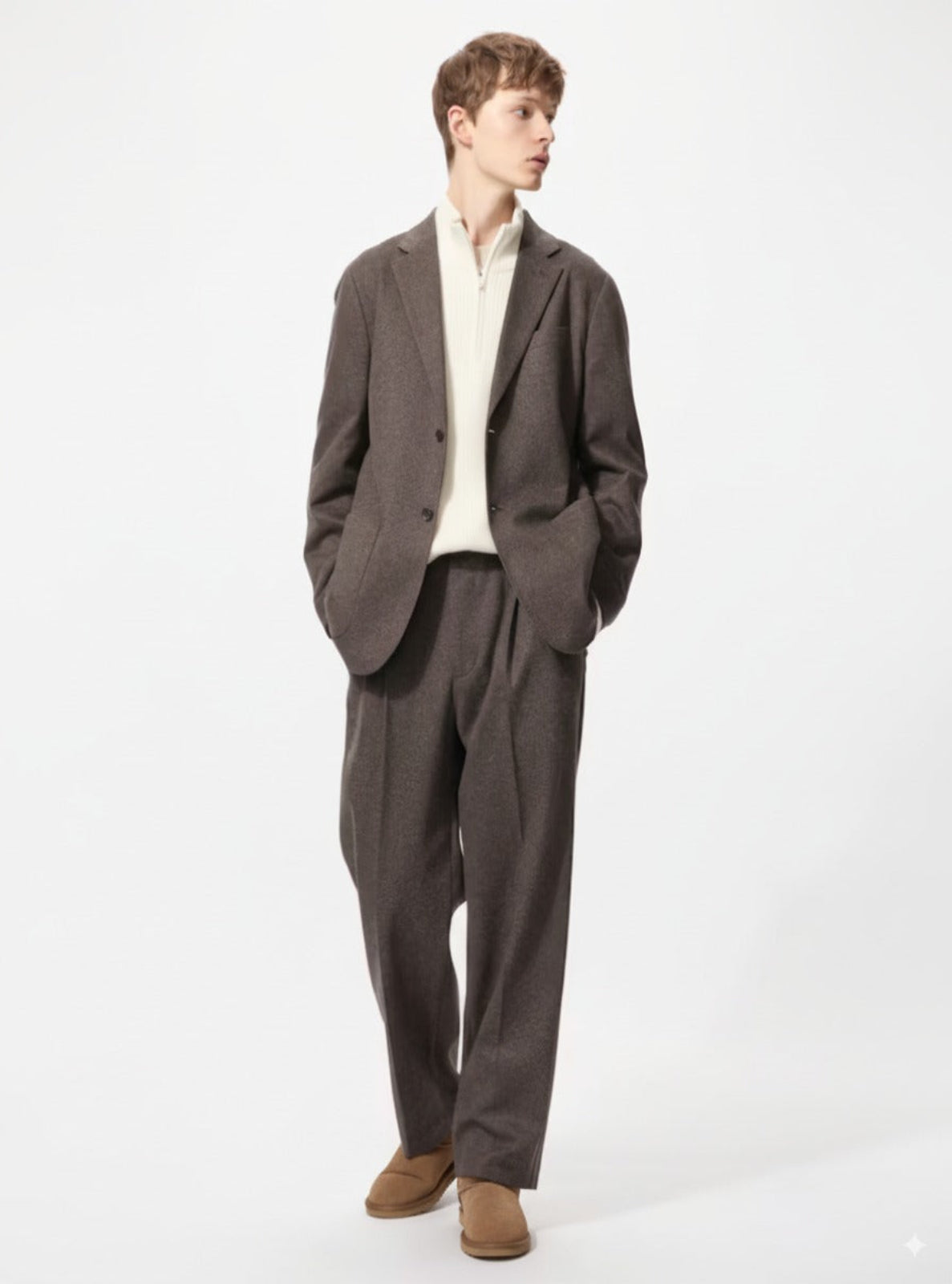 Man wearing a brown suit with a white shirt on a white background