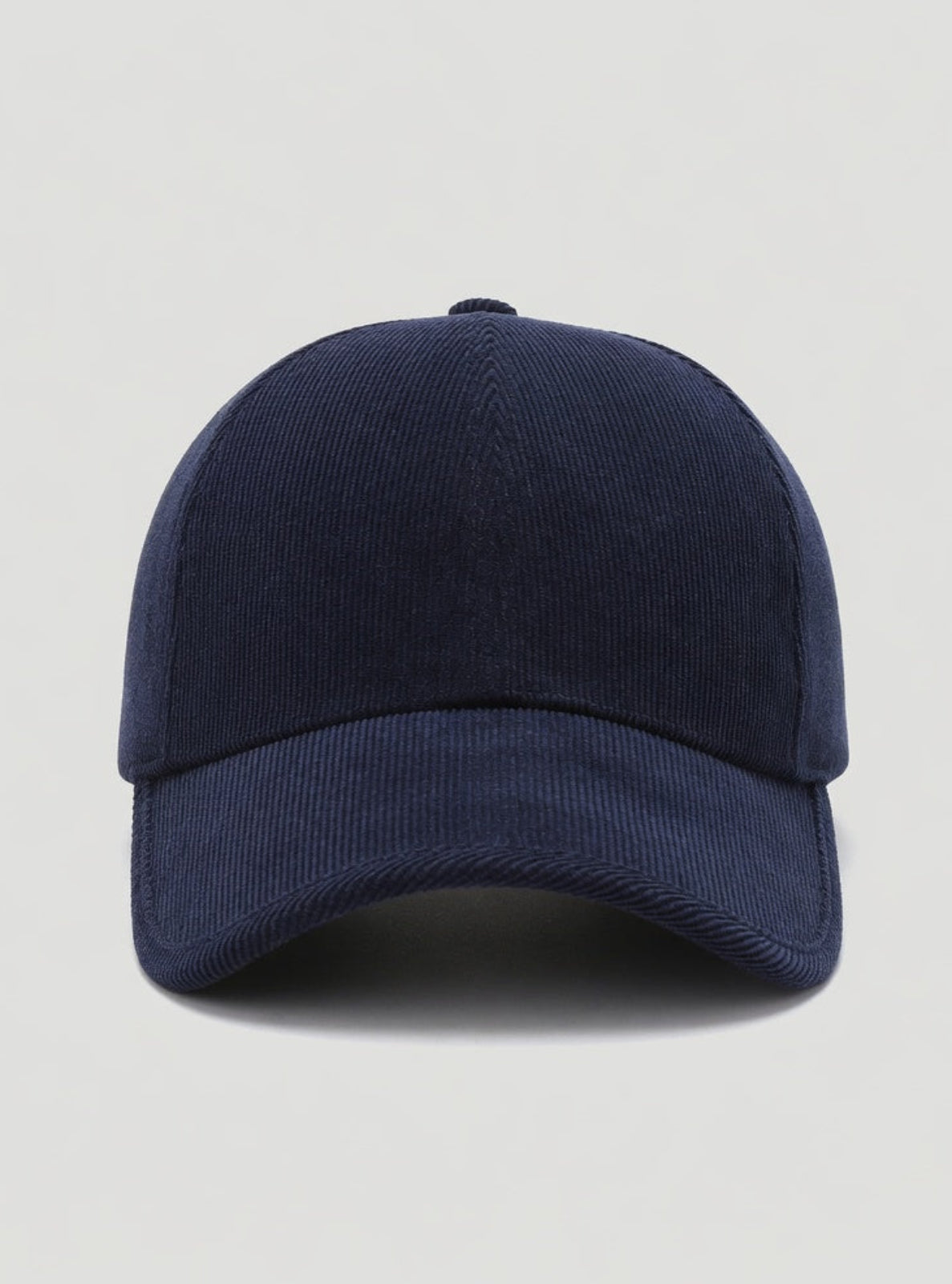 Navy blue baseball cap on a light gray background