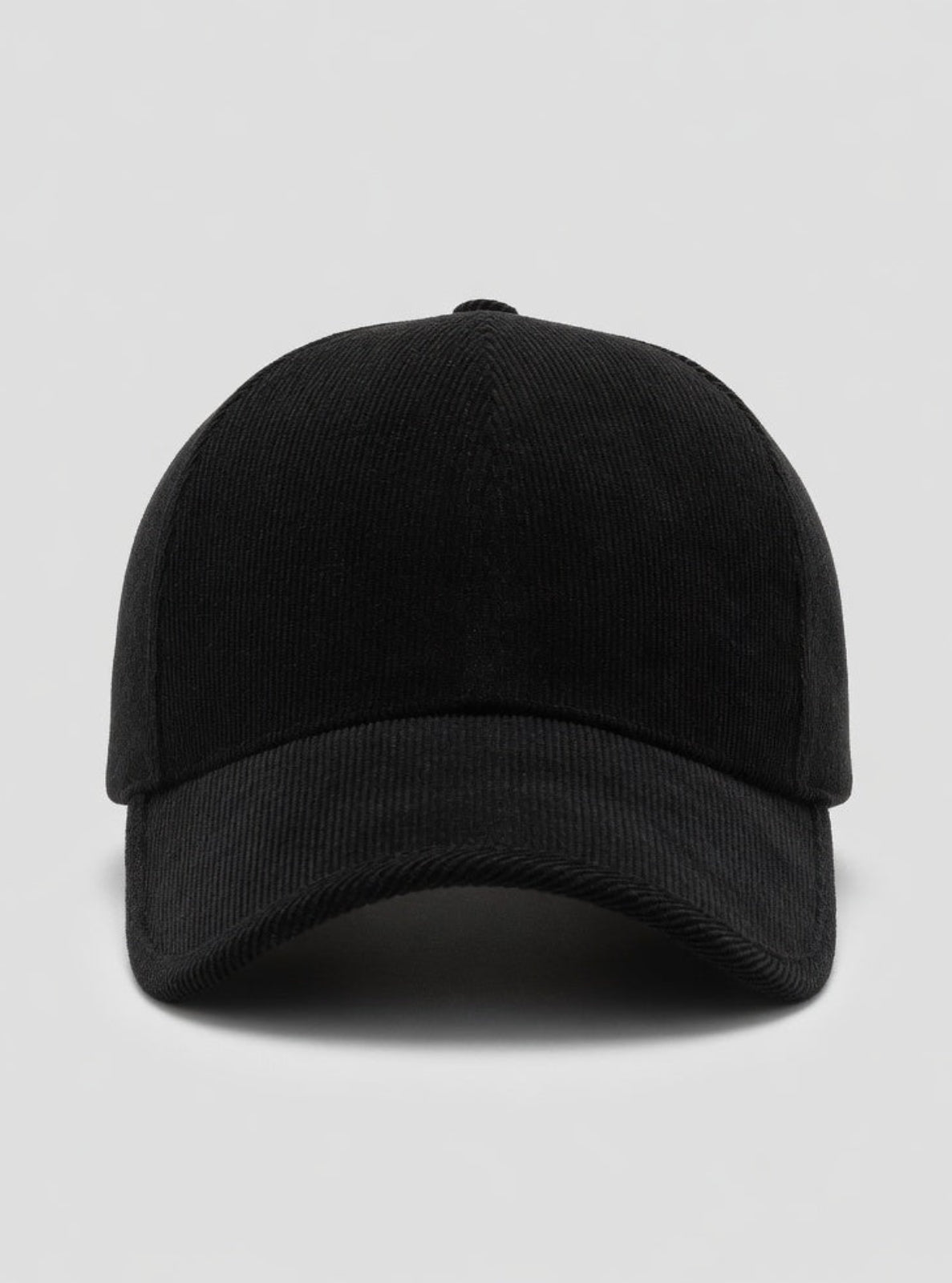 Black baseball cap on a light gray background