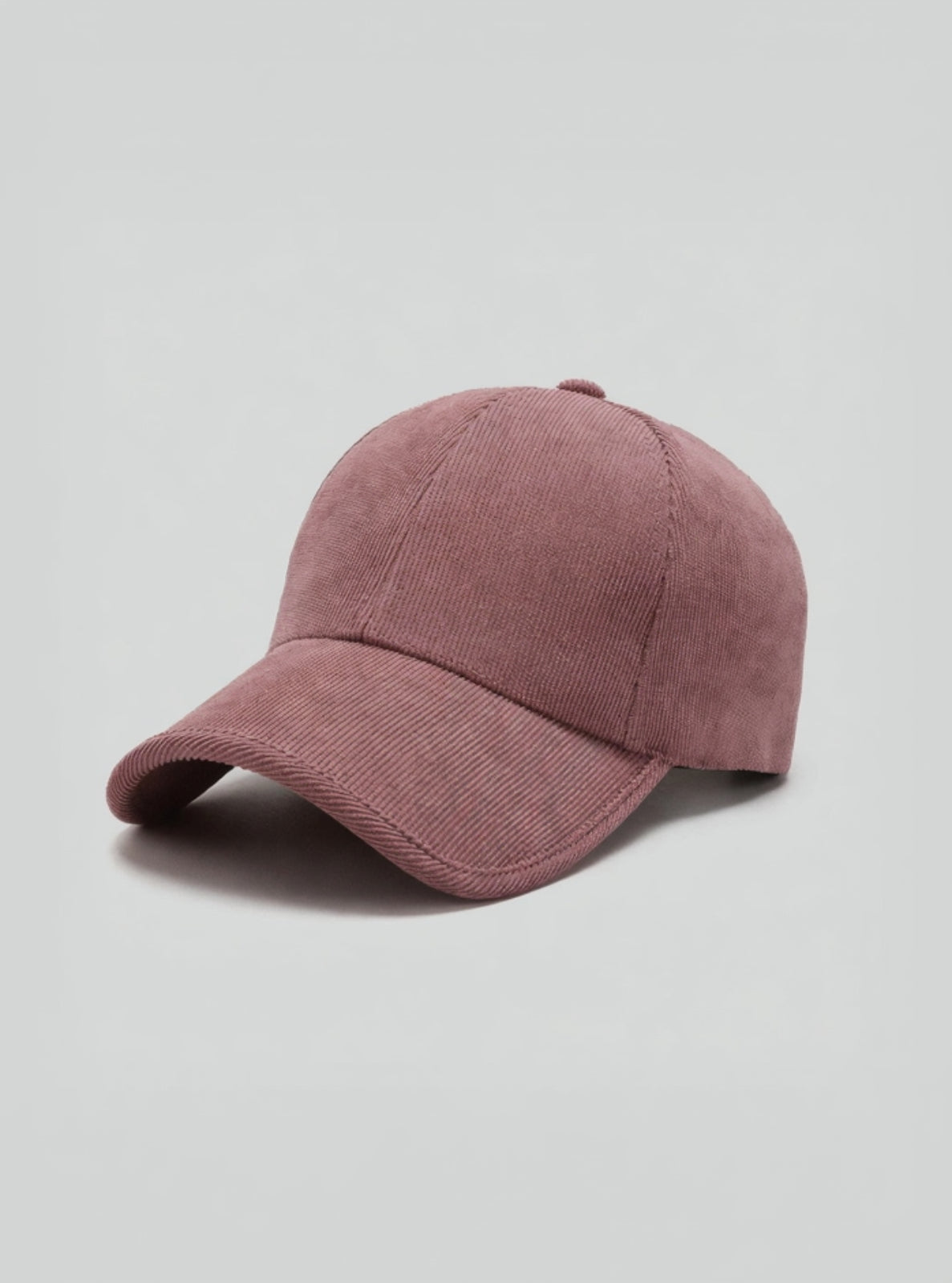 Pink baseball cap on a light gray background