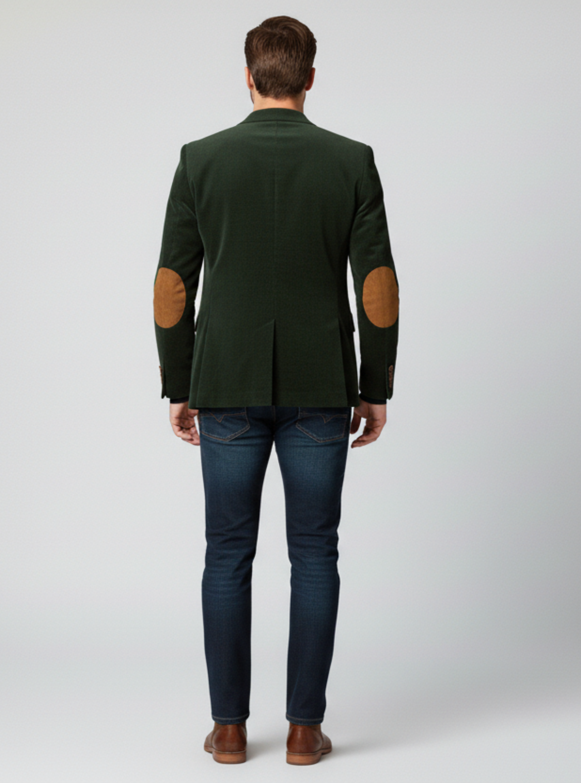 Man wearing a green jacket with elbow patches on a white background