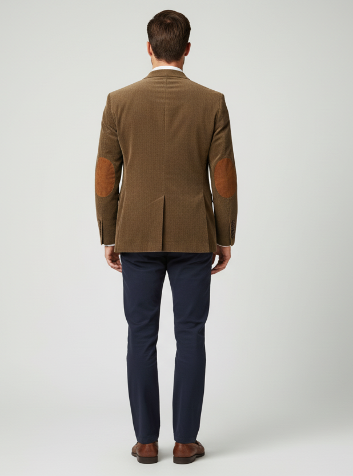 Man wearing a brown jacket with leather sleeves on a white background