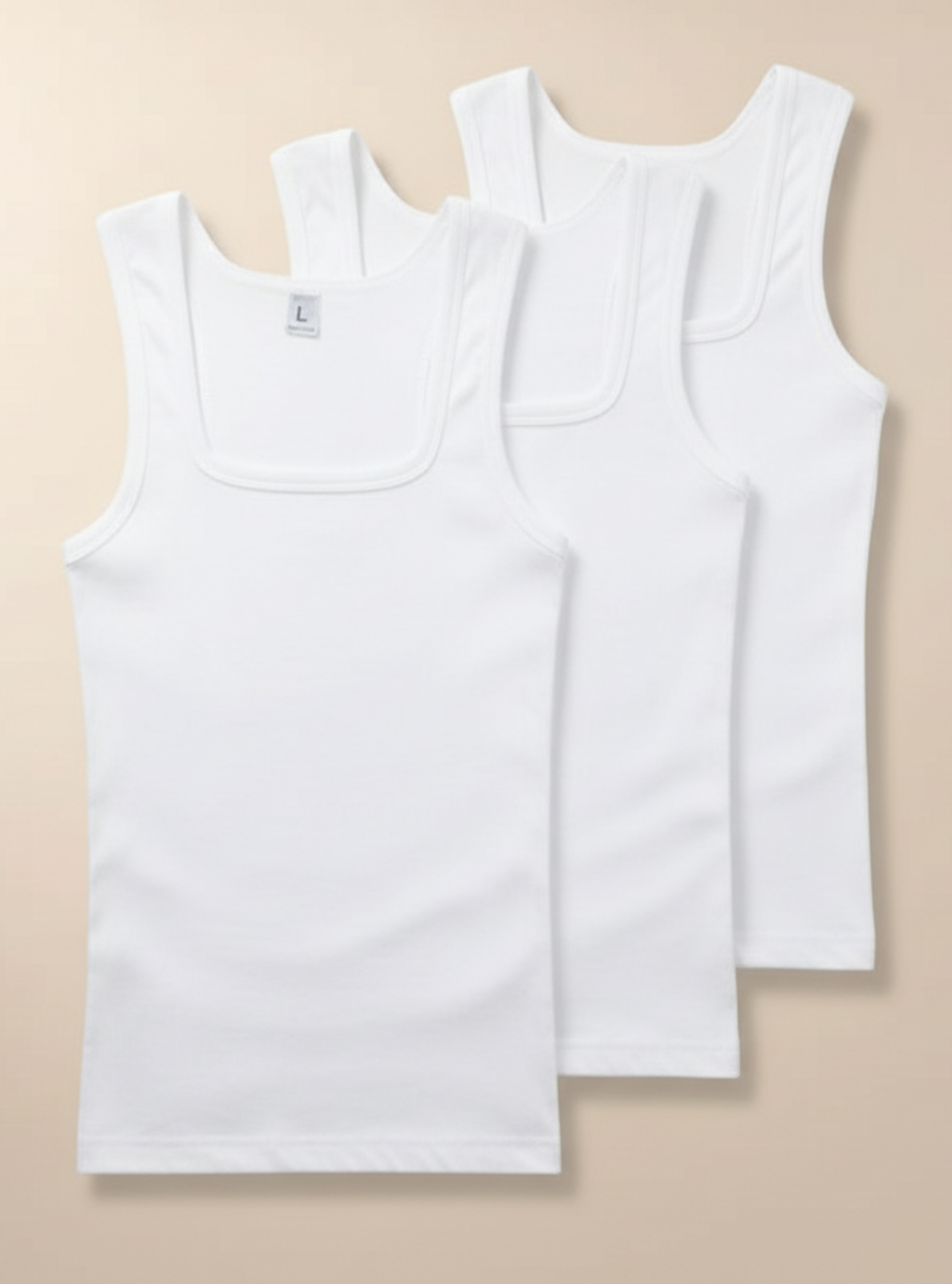 Three white tank tops on a beige background