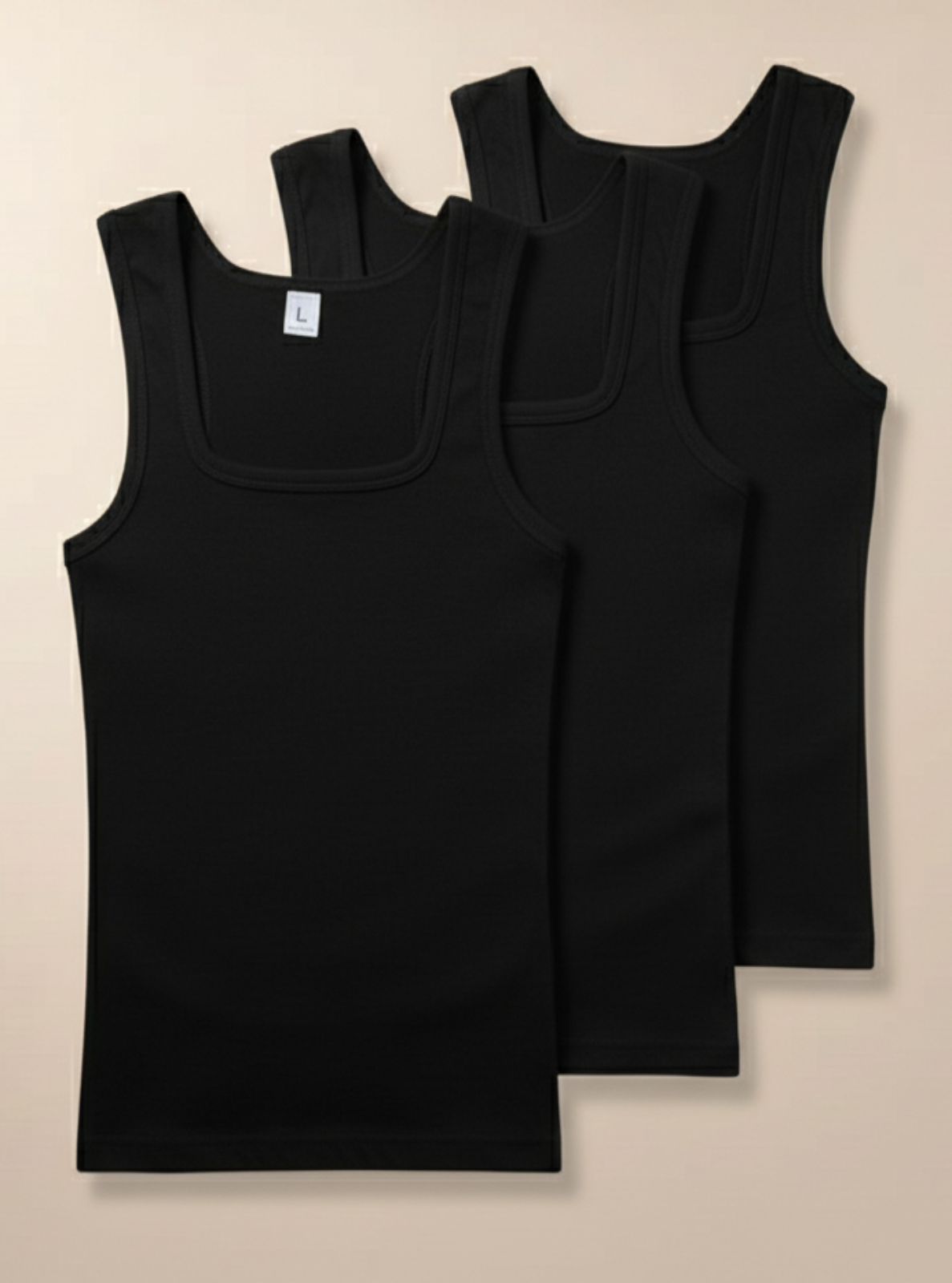 Two black tank tops on a beige background