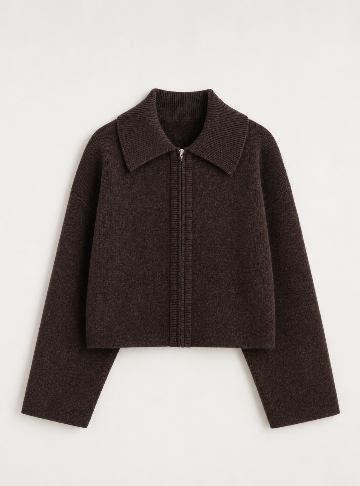 A dark brown cropped knit zip-up jacket with a wide collar and long sleeves, displayed flat against a light off-white background.