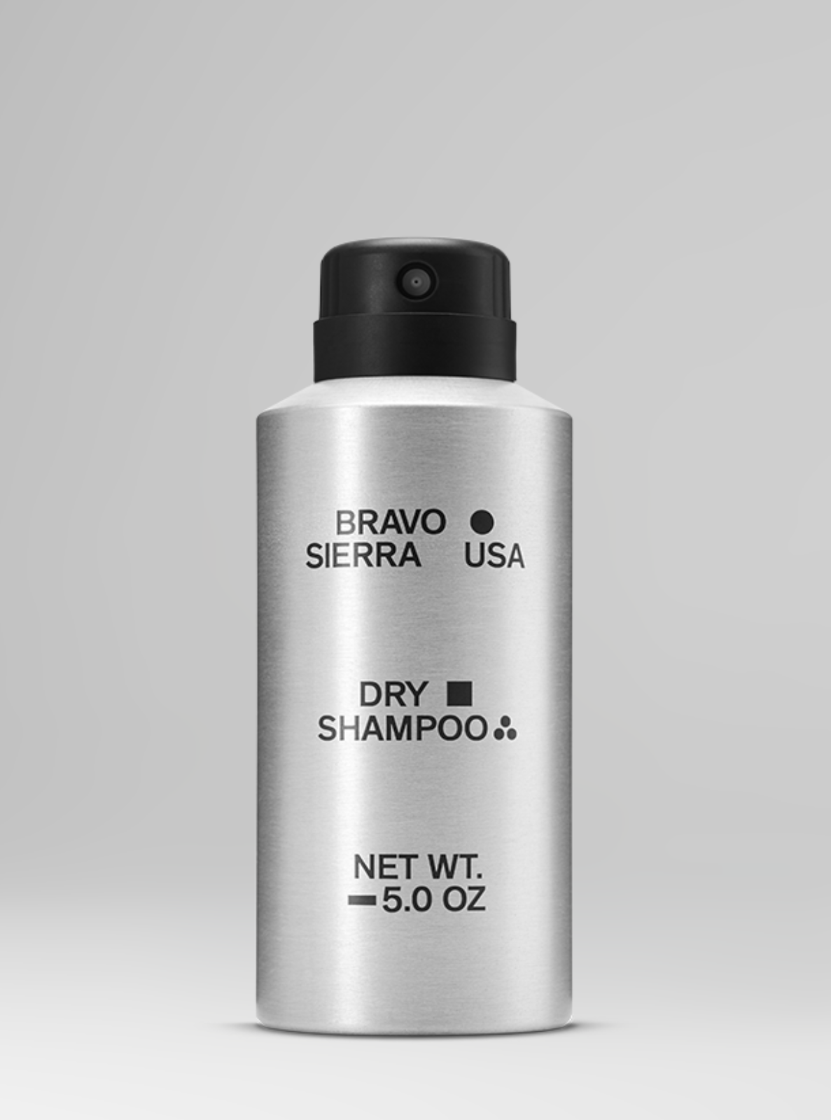 Silver bottle of Bravo Sierra USA dry shampoo on a gray background