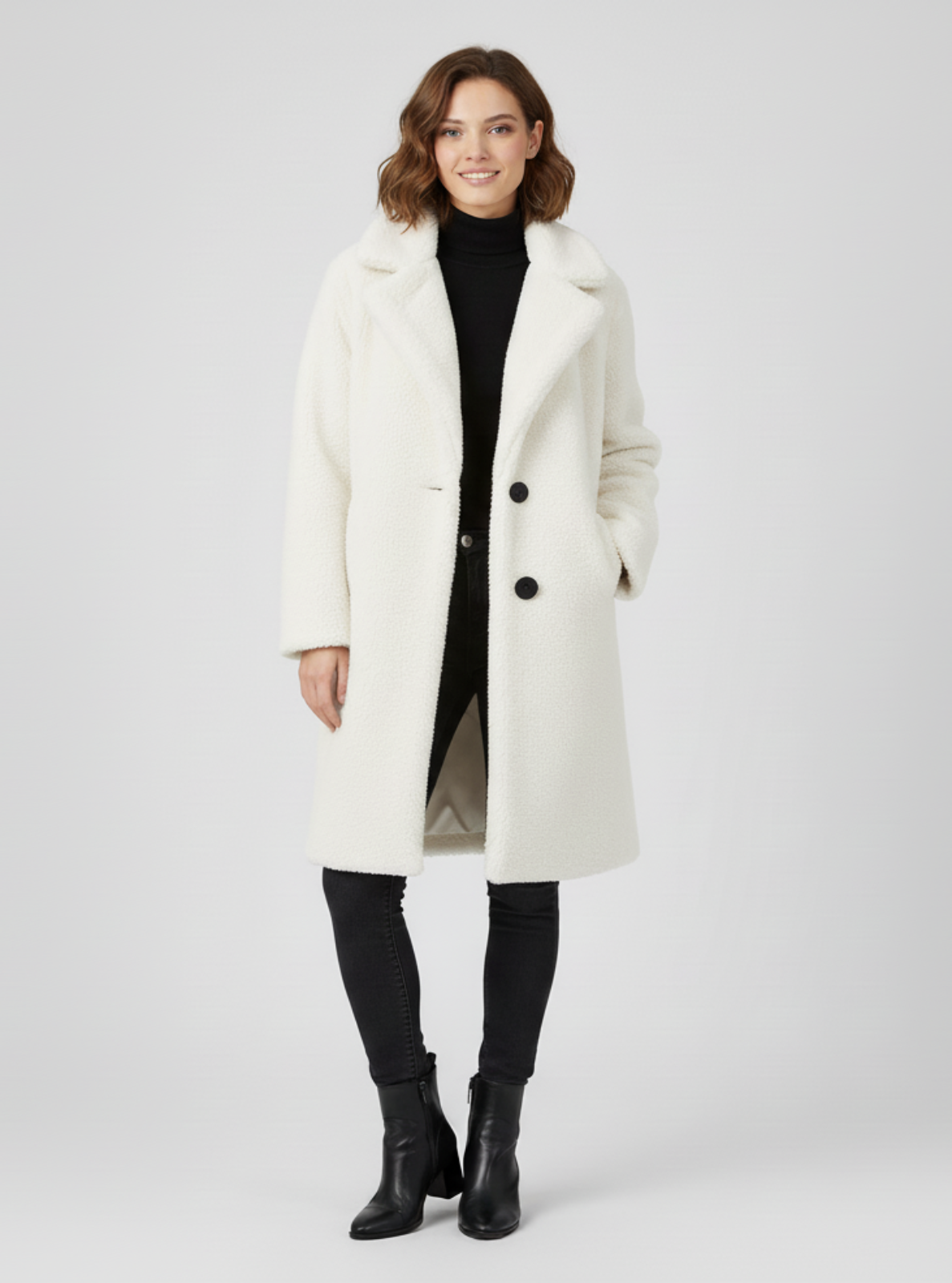 Woman wearing a white coat on a light gray background