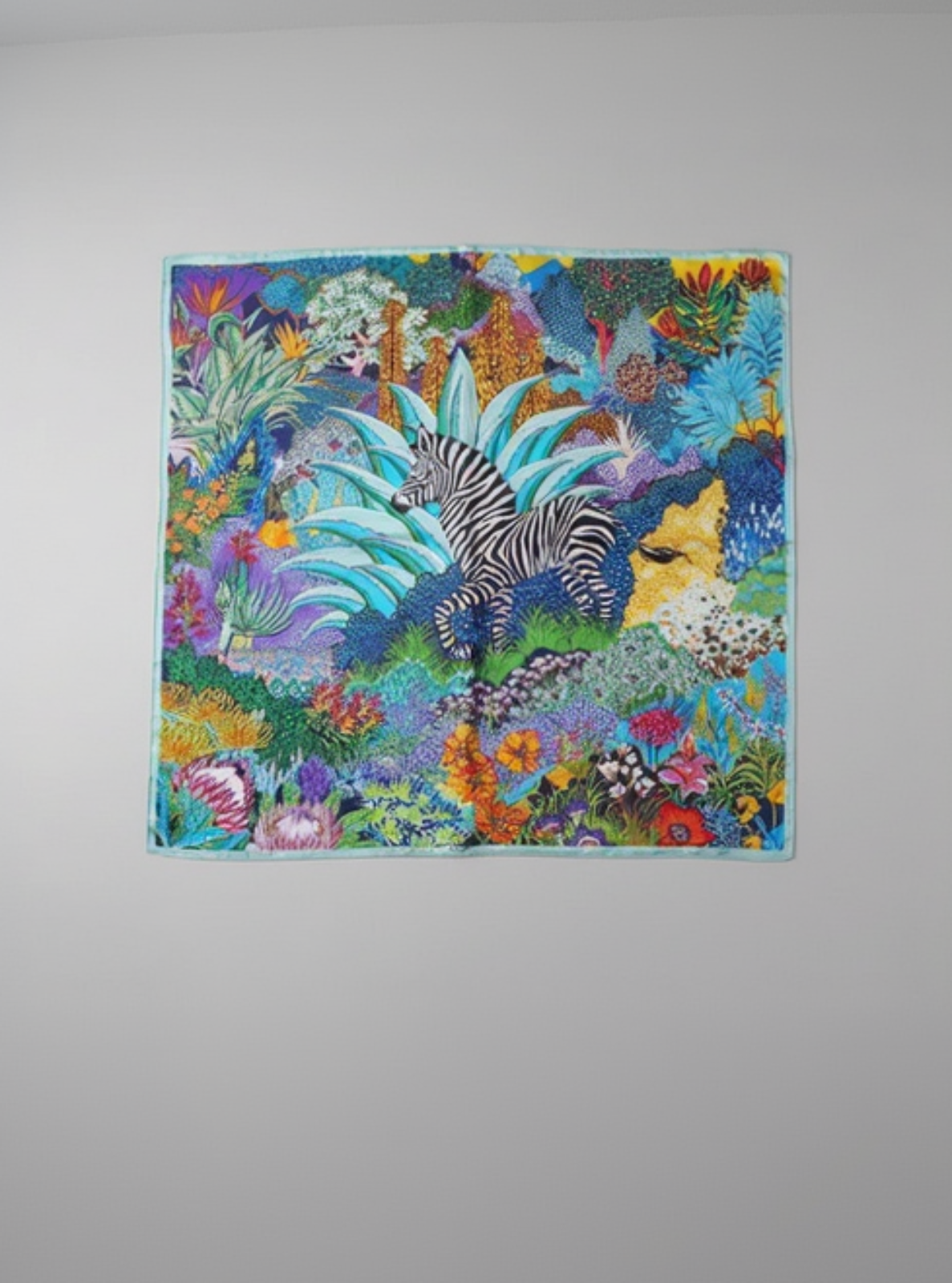 Colorful quilt with a zebra design on a gray background