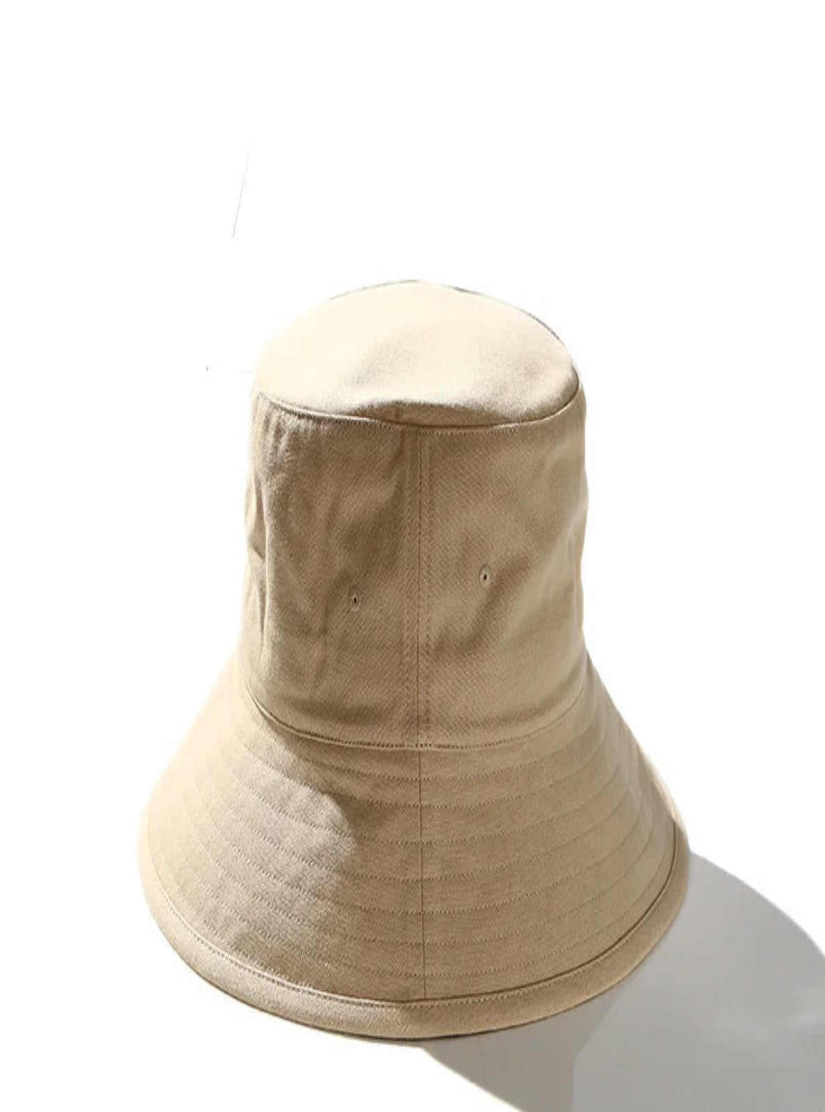 Beige bucket hat on a white background