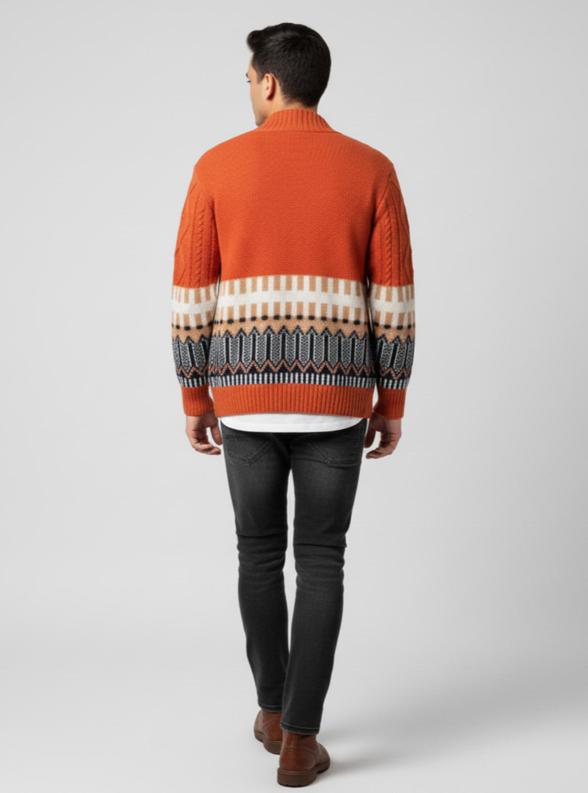 Man wearing an orange sweater with a patterned design on a white background