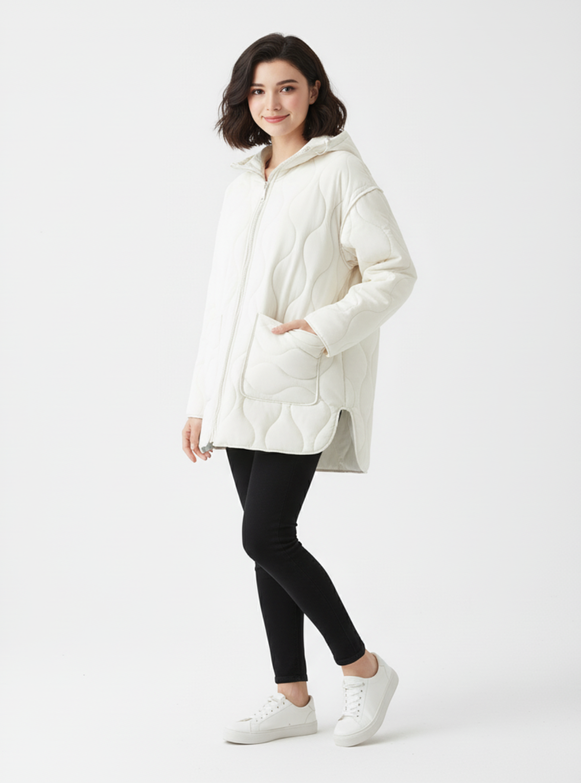 Woman wearing a white puffer jacket on a white background