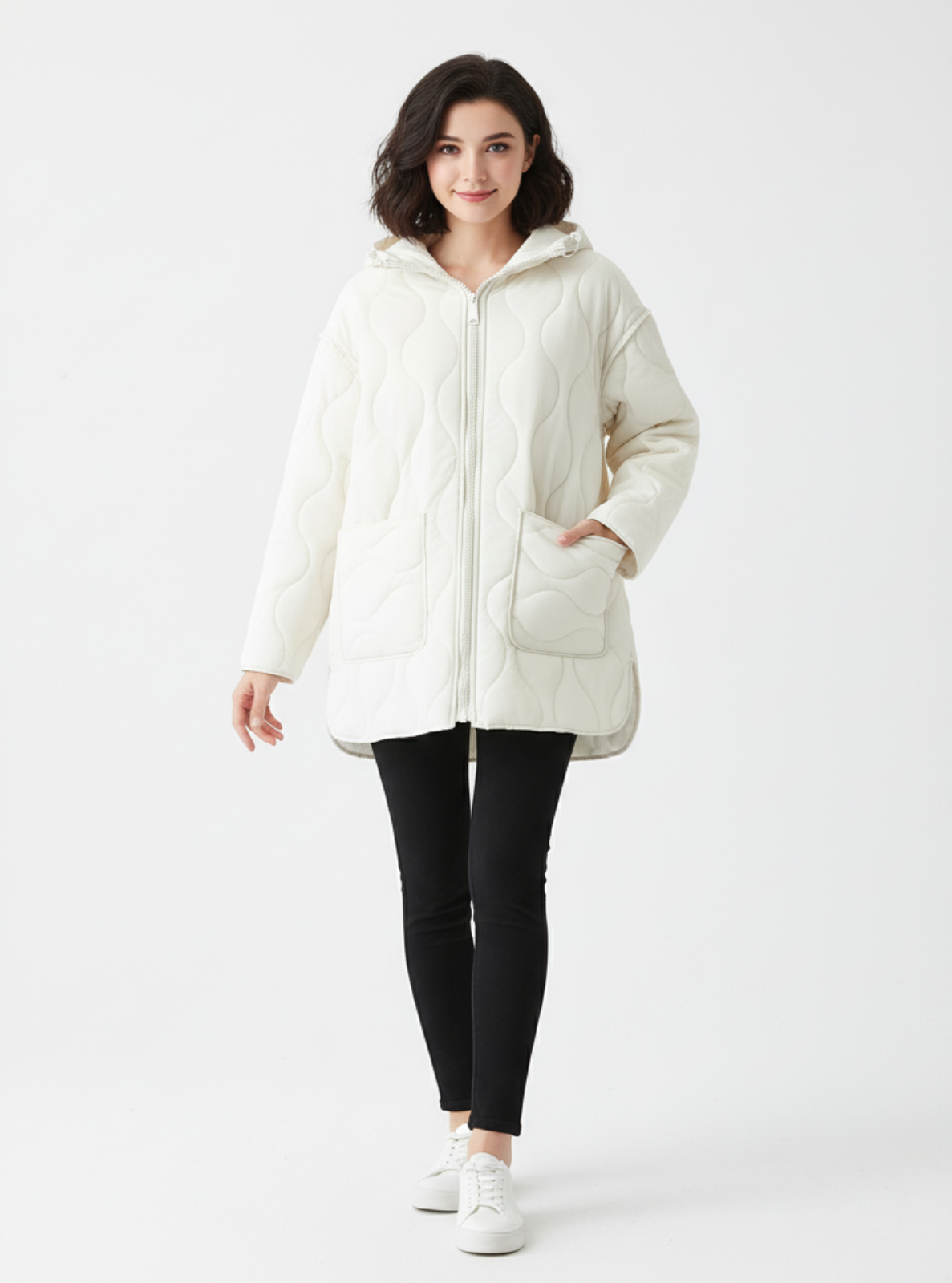 Woman wearing a white hooded jacket on a white background