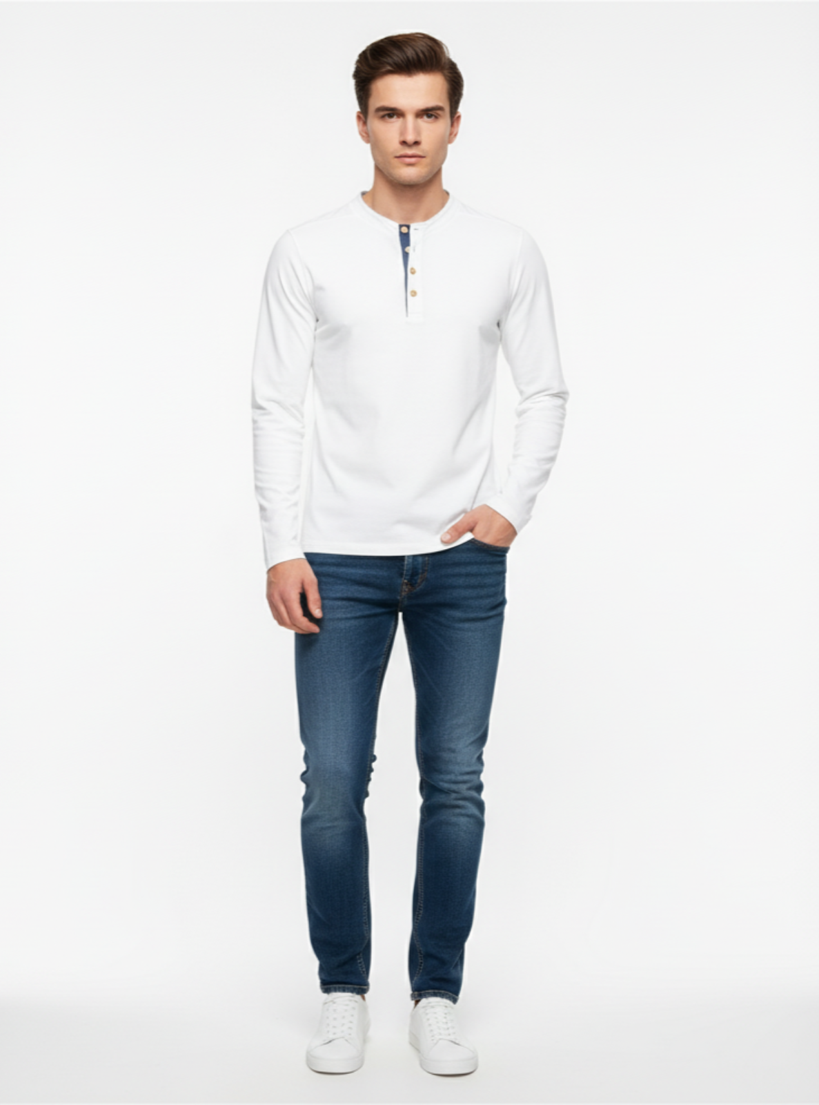 Man wearing a white long-sleeve shirt and blue jeans on a white background
