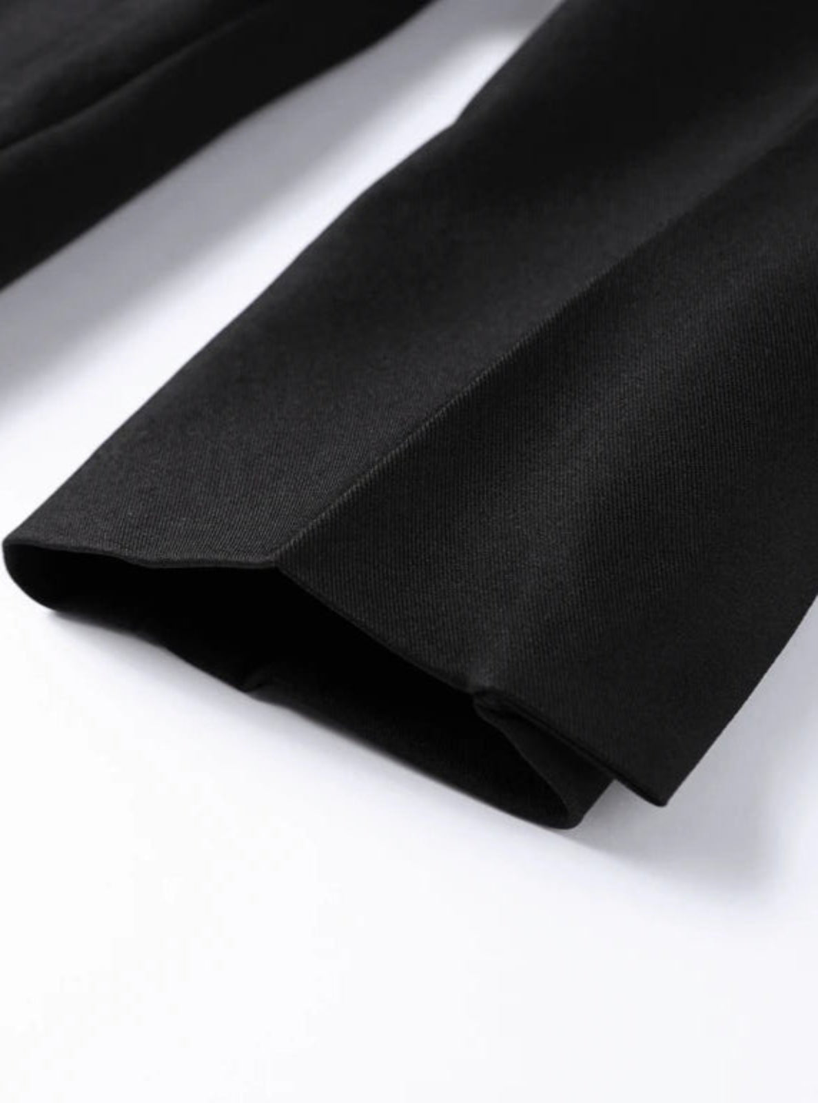 Close-up of black fabric on a white background