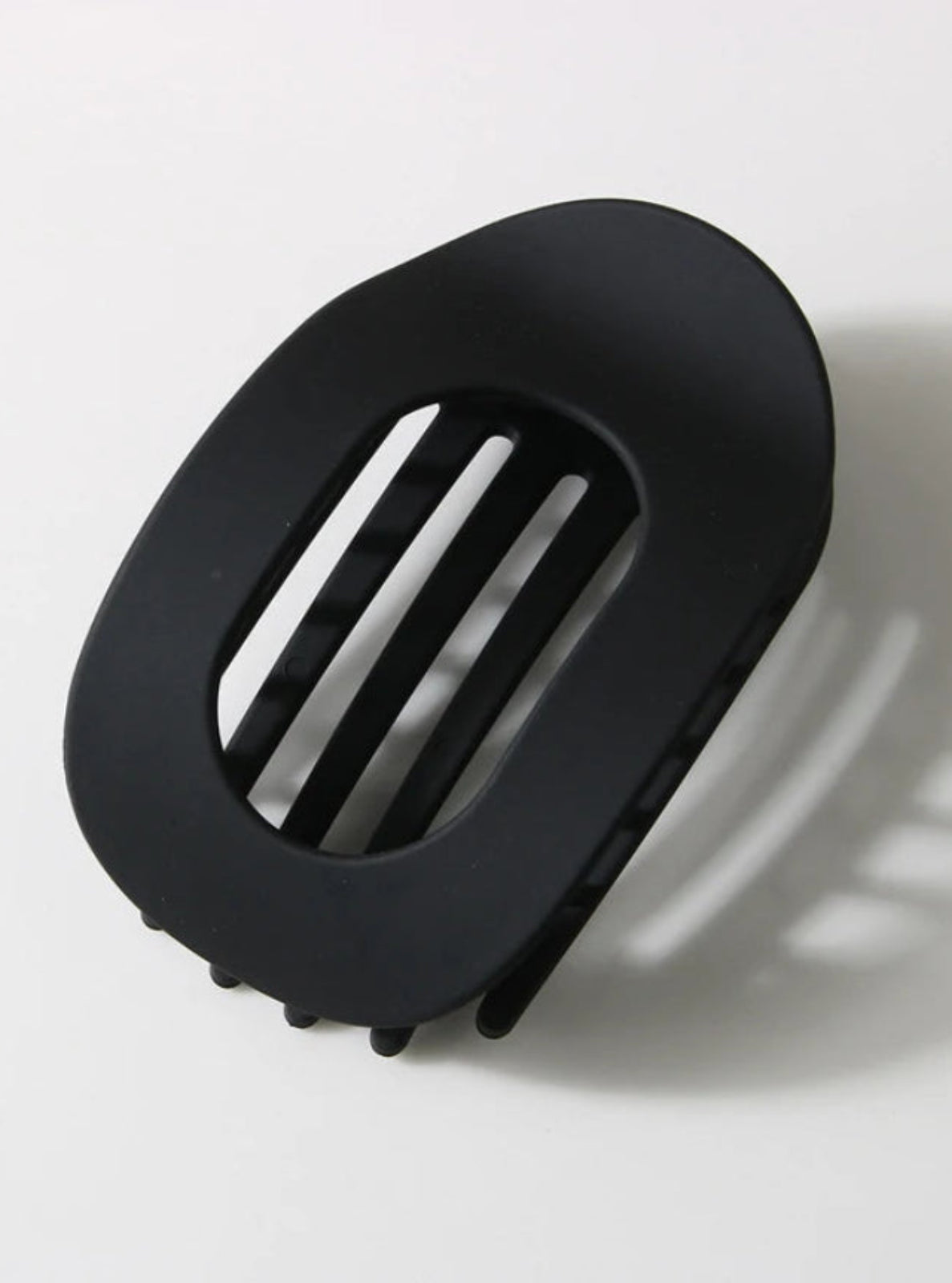 Black hair clip on a white background