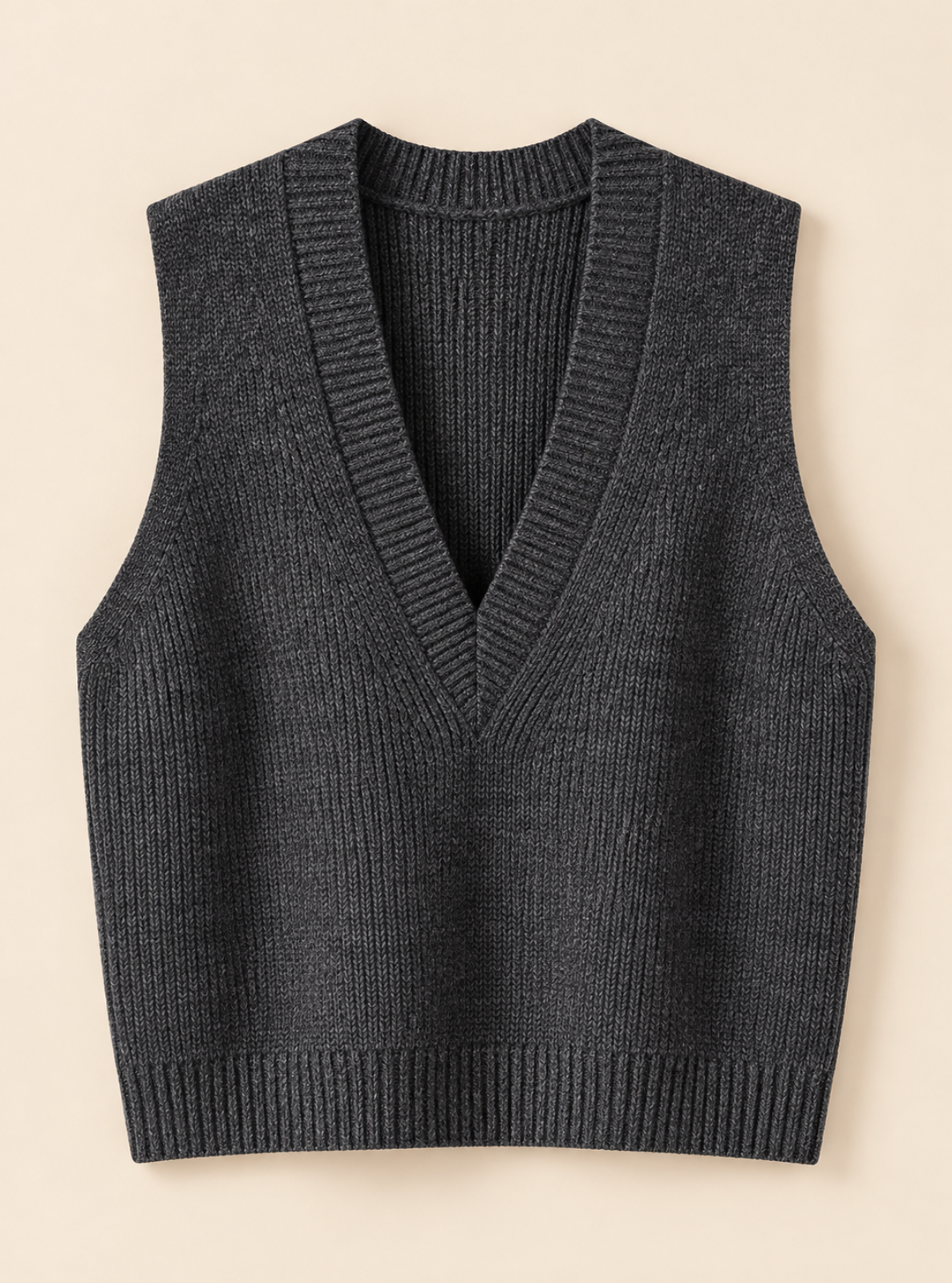 A dark charcoal gray ribbed knit sweater vest with a V-neck, shown flat against a light beige background.