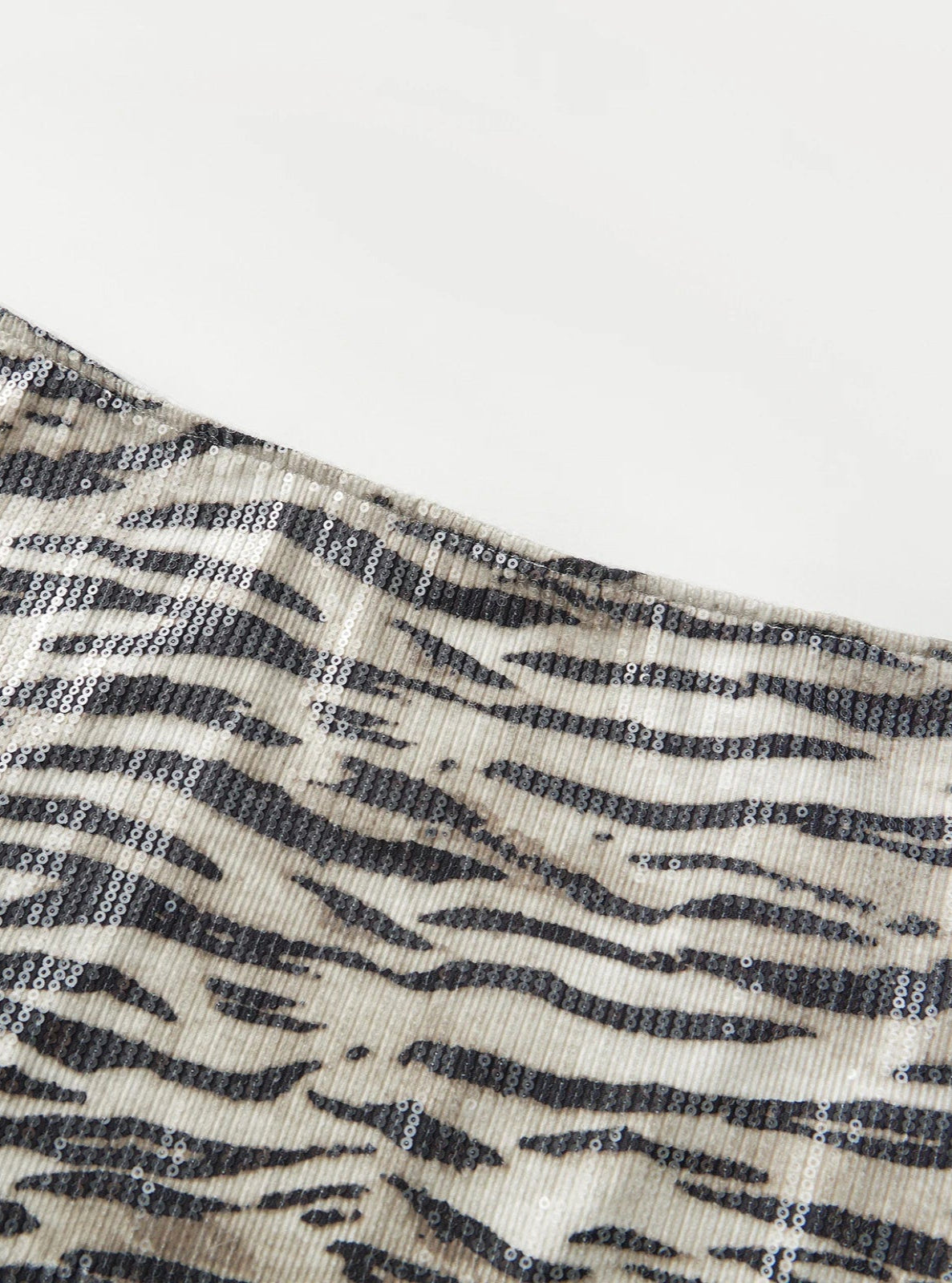 Close-up of a fabric with a zebra pattern on a white background