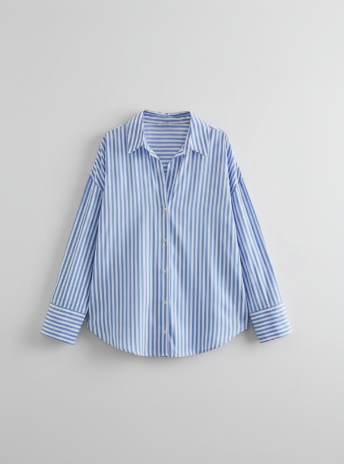 Blue and white striped shirt on a light gray background