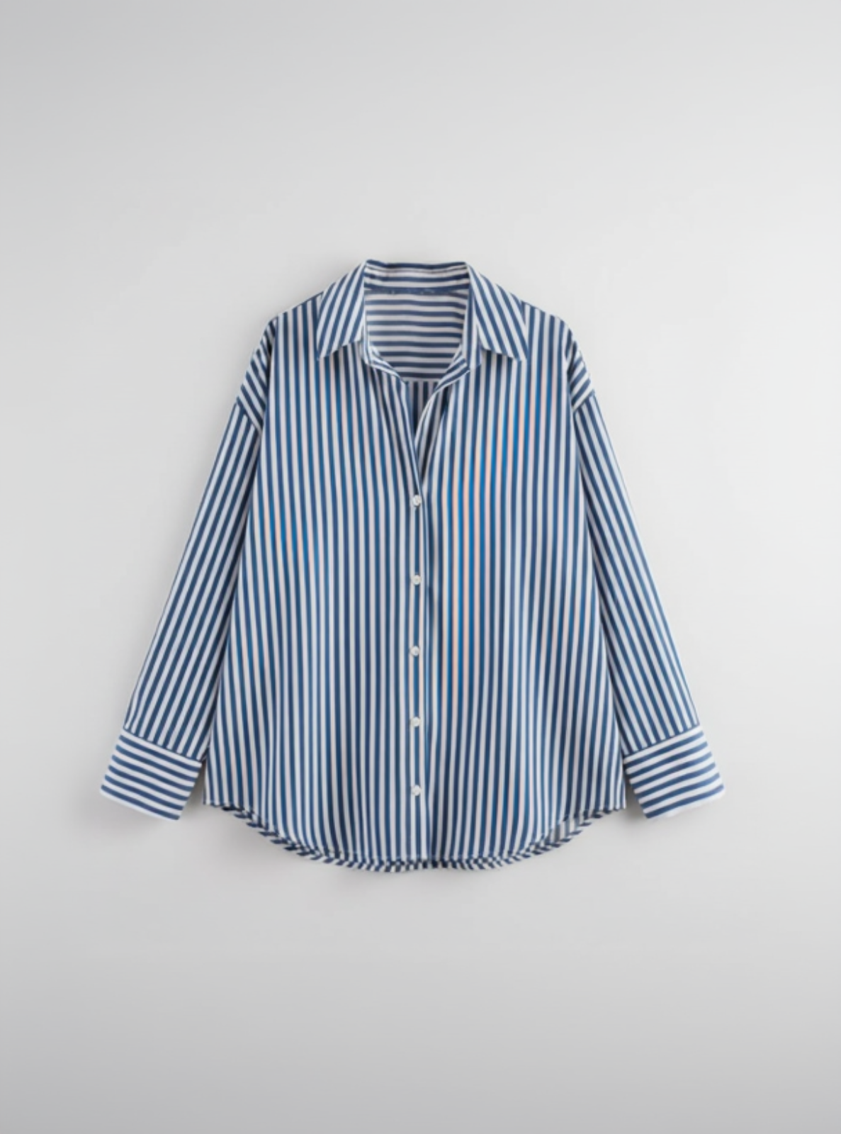 Blue and white striped shirt on a light gray background
