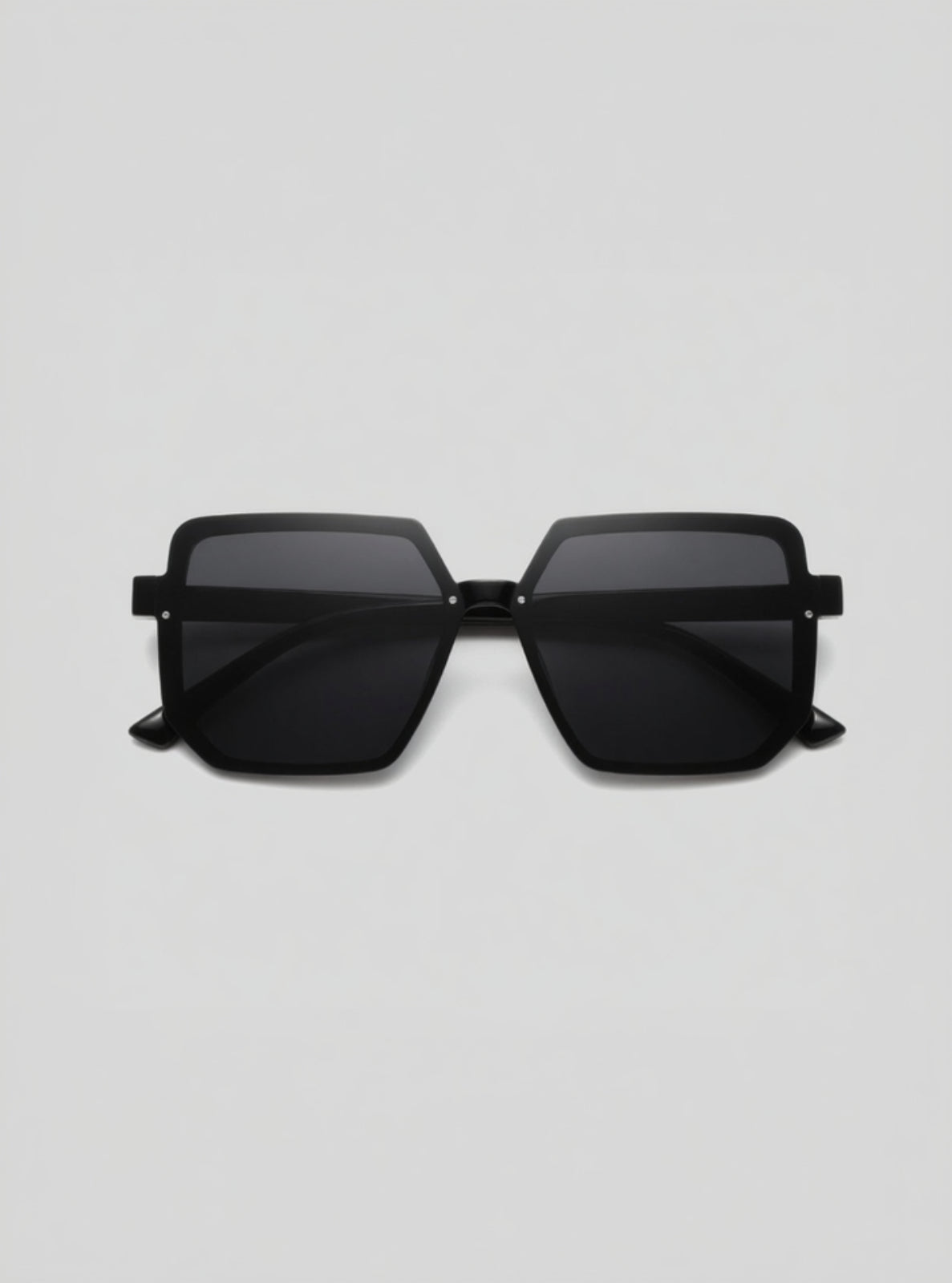 Black sunglasses on a light gray background