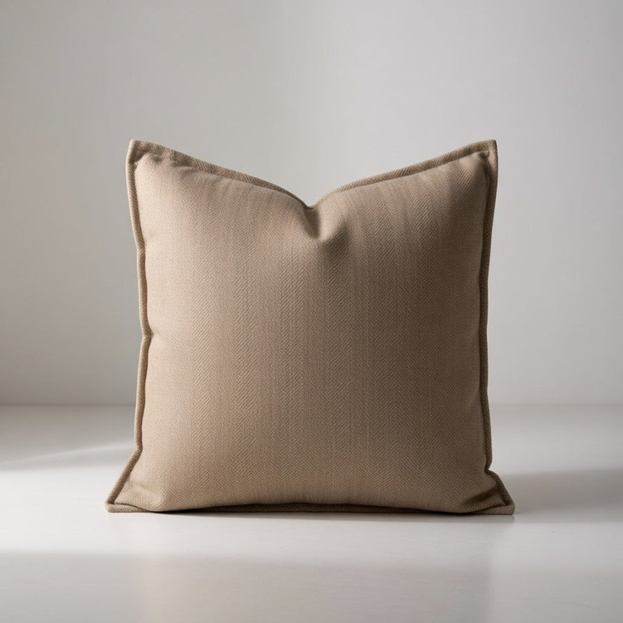 Beige pillow on a neutral background