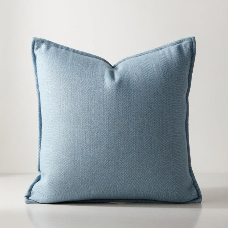 Blue pillow on a light gray background