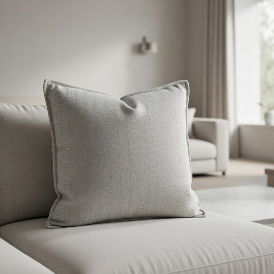 Gray pillow on a beige sofa in a modern living room