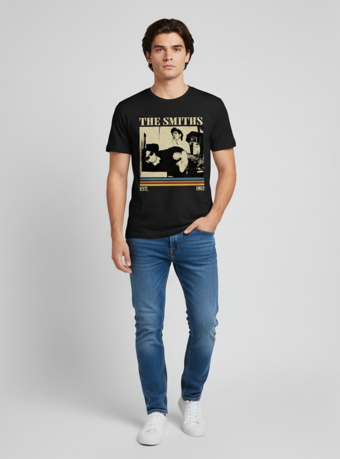 Person wearing a black t-shirt with 'The Smiths' band graphic on a plain background