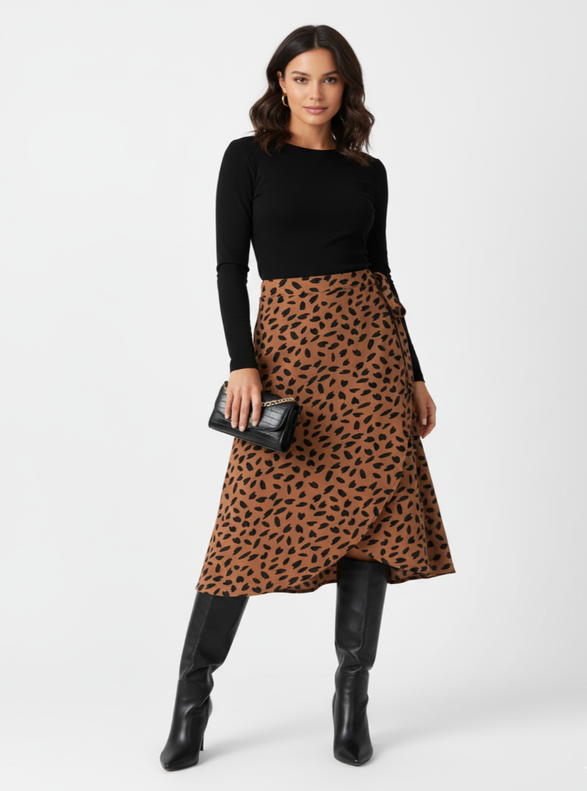 Woman wearing a black top and leopard print skirt on a white background