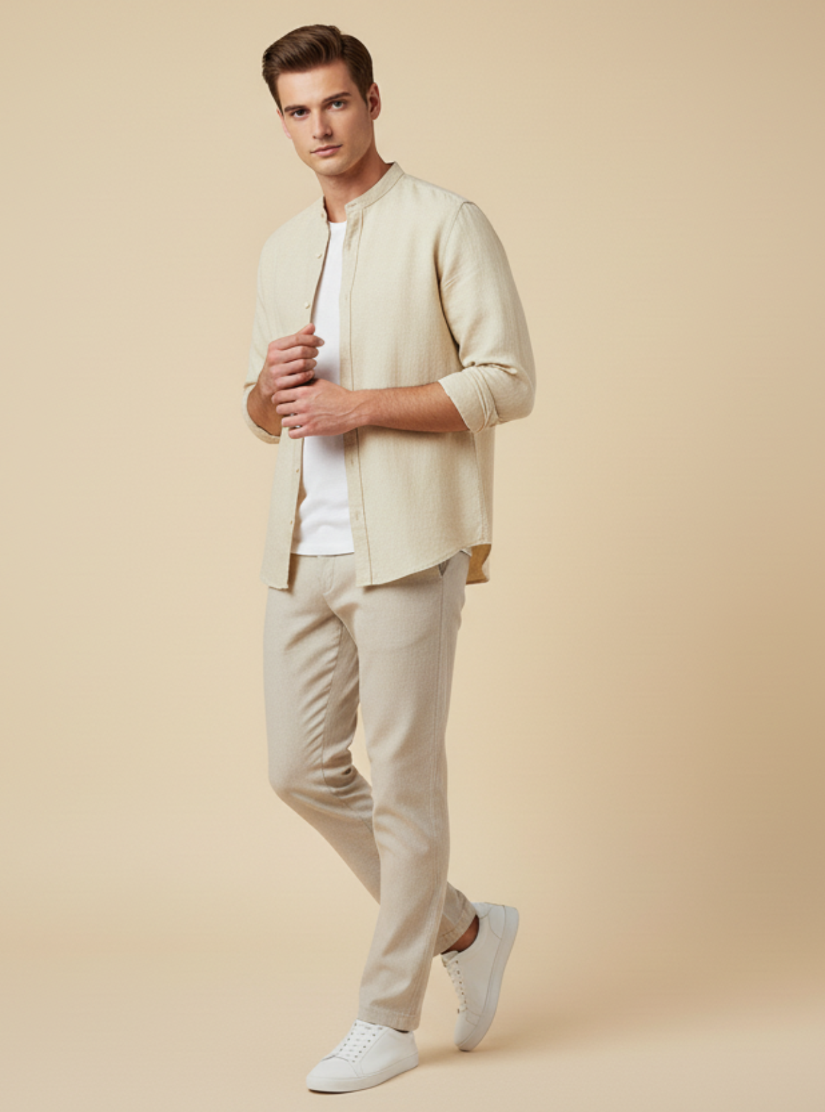 Man wearing a light-colored suit on a beige background