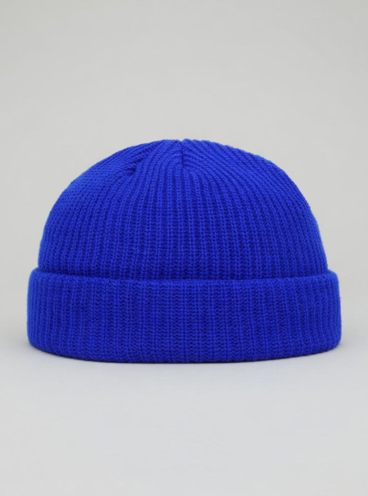Blue beanie on a gray background