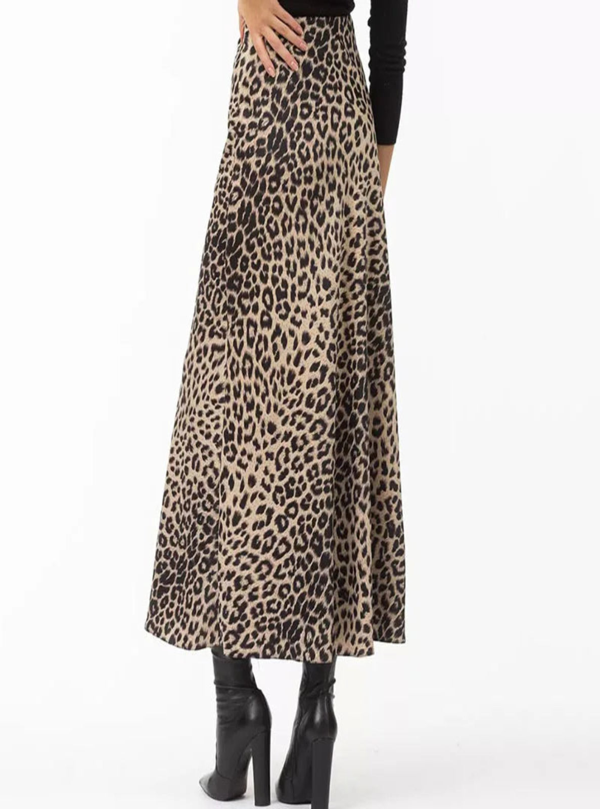 Leopard print skirt worn by a person on a white background