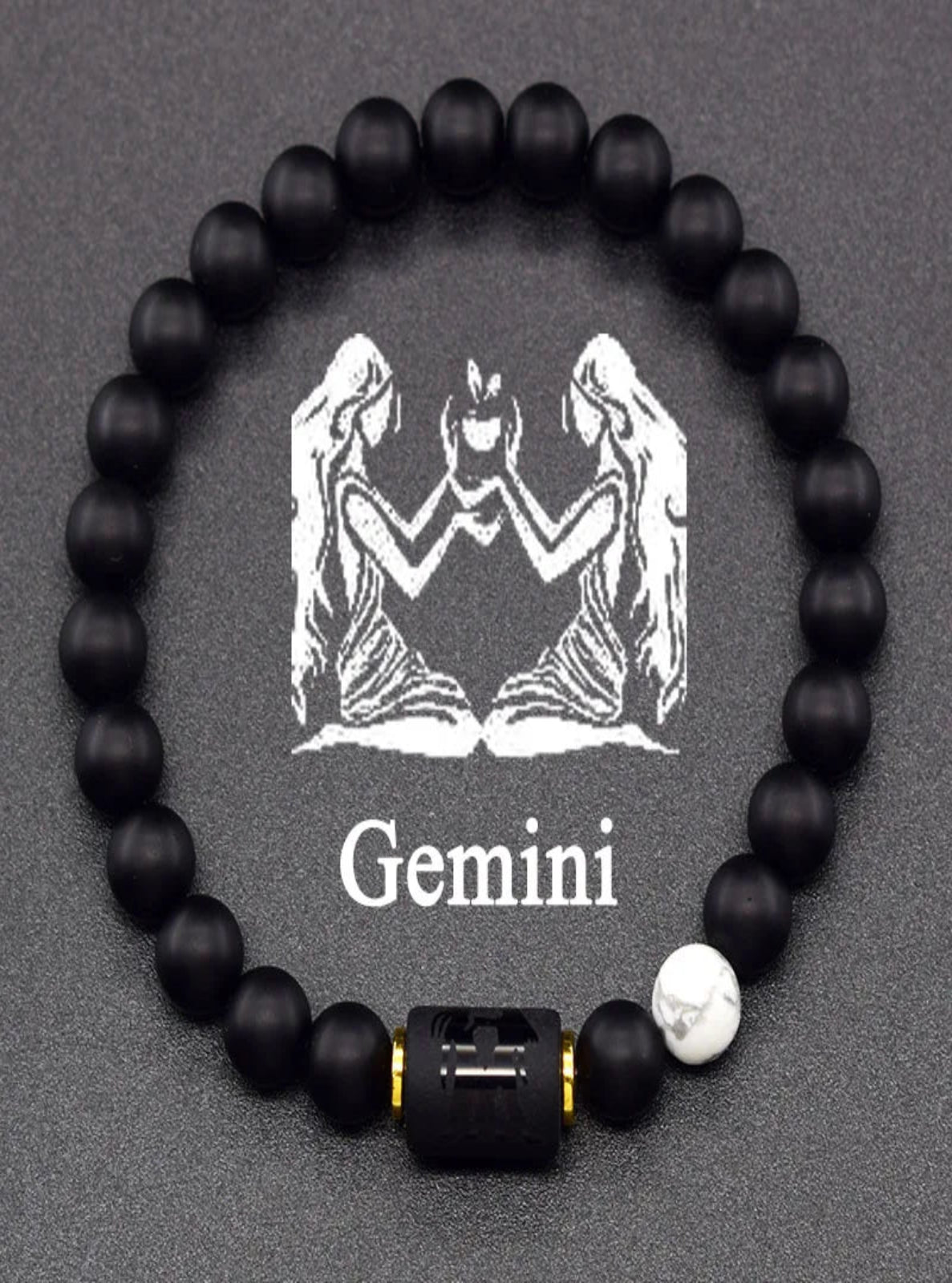 Black beaded bracelet with Gemini zodiac symbol on a dark background