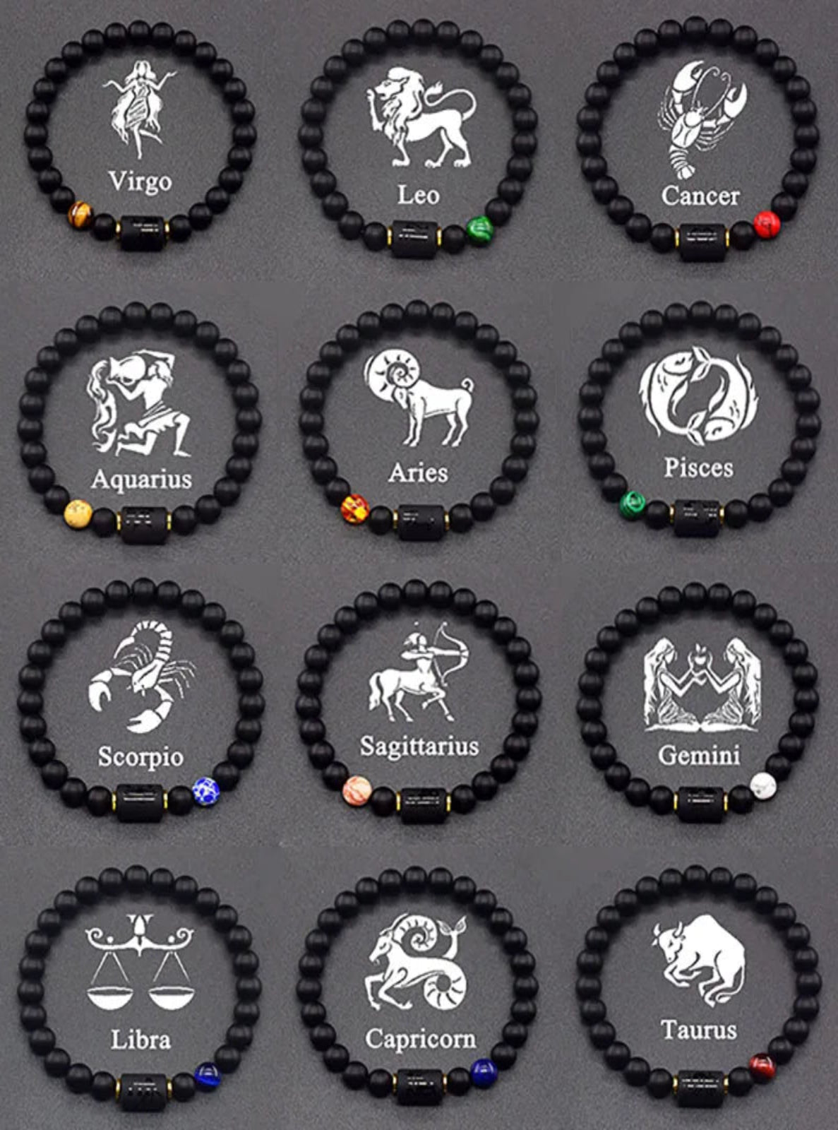Black beaded bracelets with zodiac symbols on a gray background