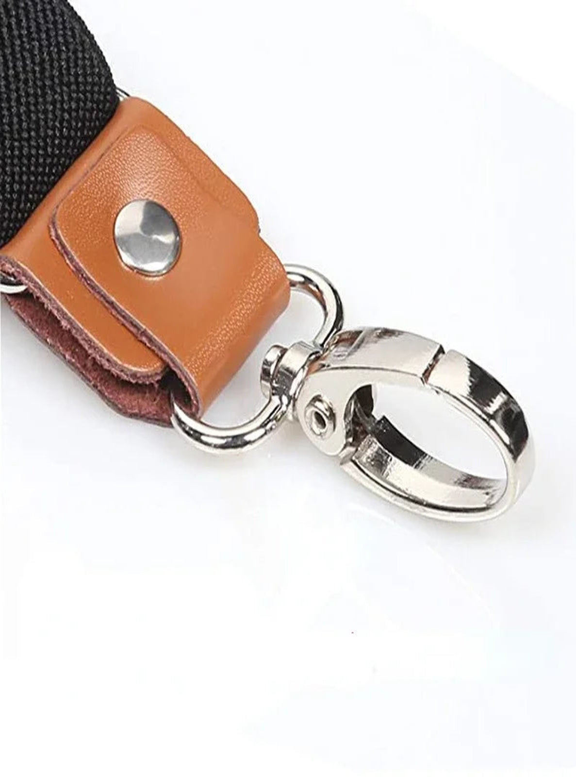 Black suspenders with brown leather on a white background